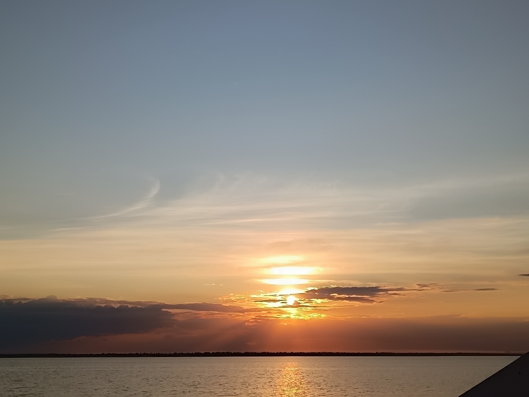Golden hour at the waterfront, with a few quiet shoreline details