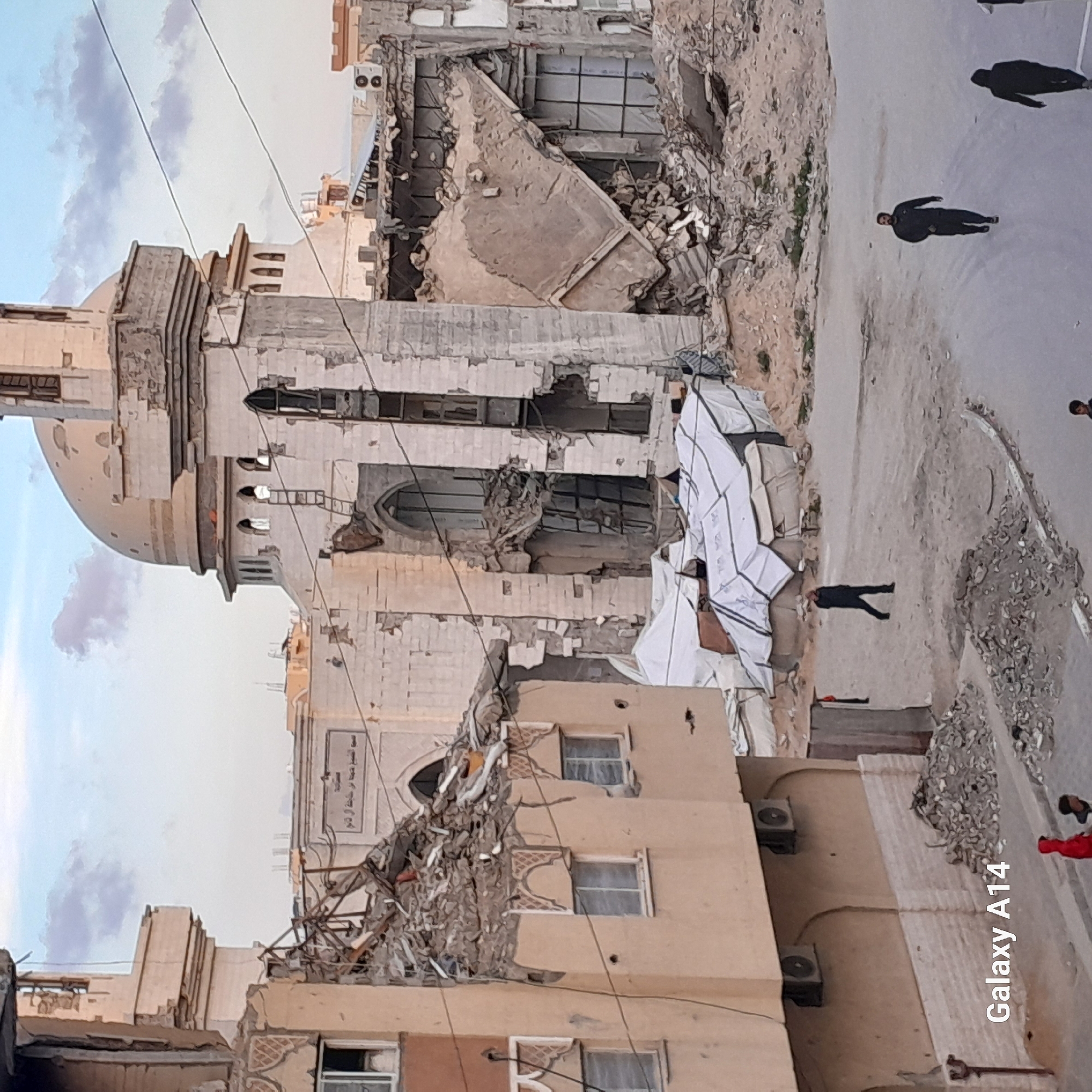 Residents navigate damaged buildings and makeshift settlements in Khan Yunis