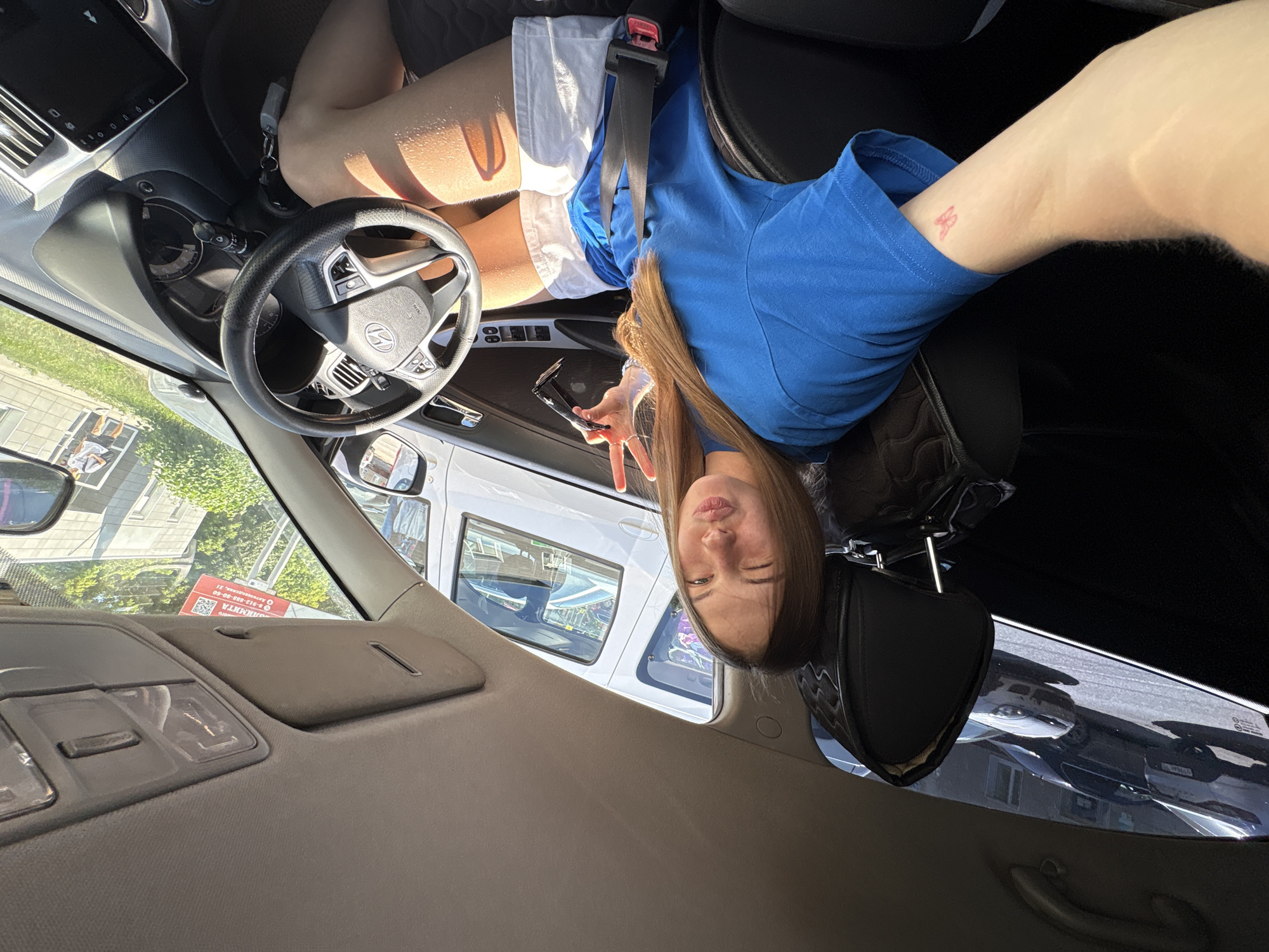 Car selfie session in Perm on a sunny June afternoon