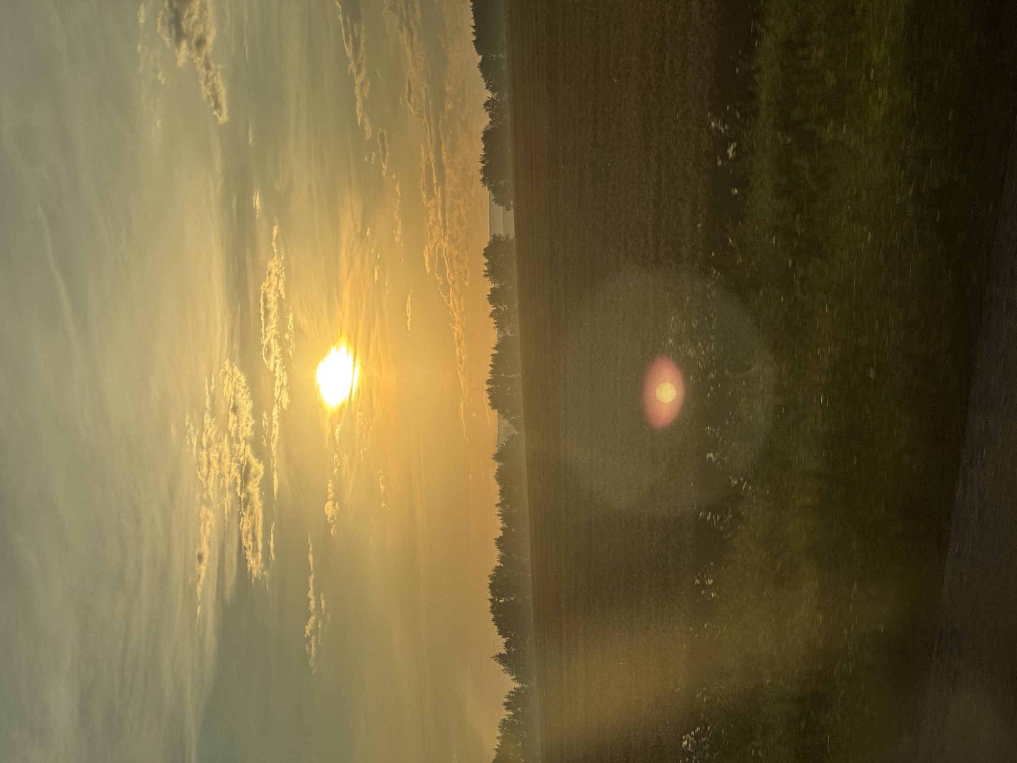 Hazy rural sunset near the Urals, Russia