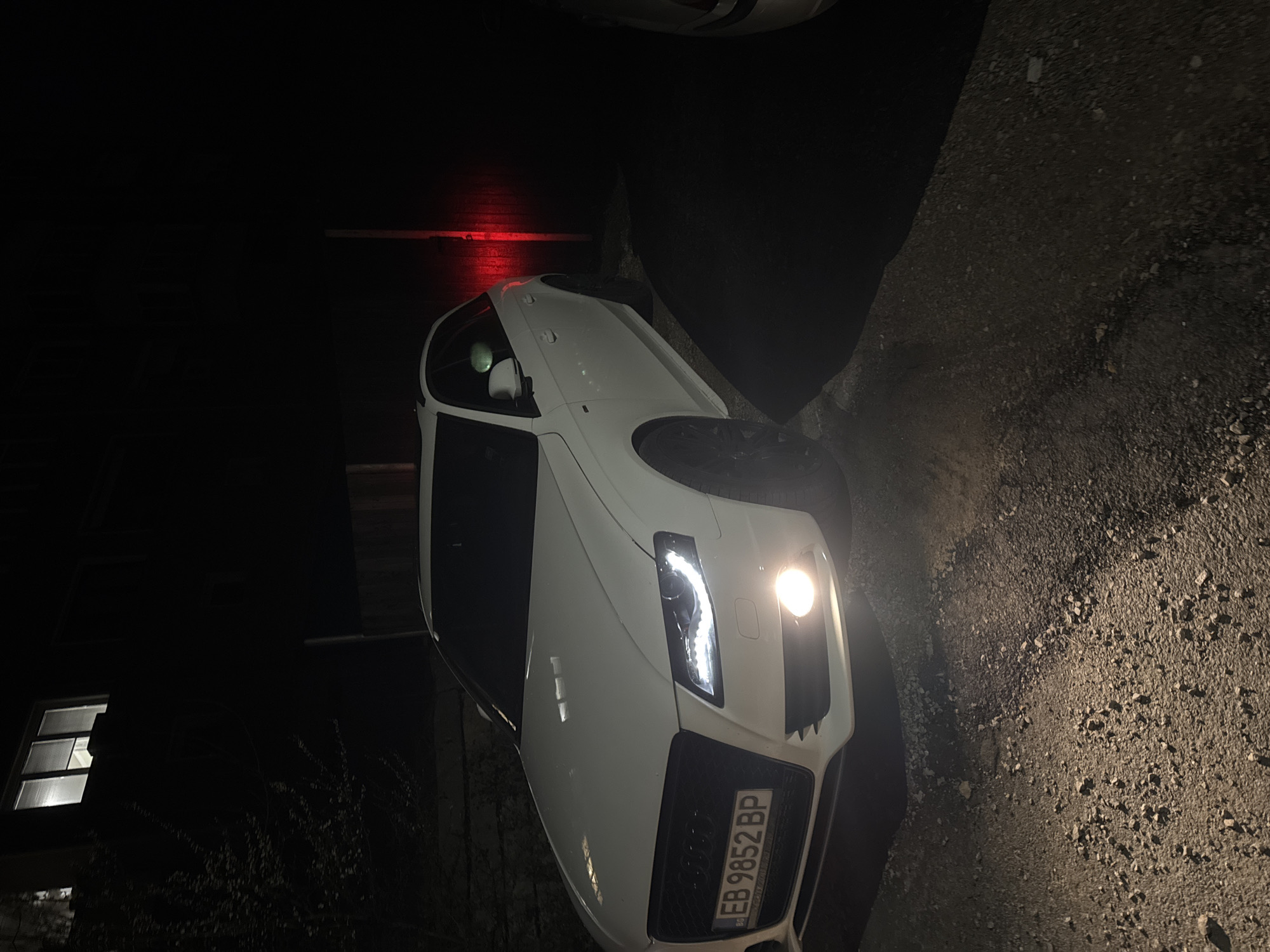White Audi parks in residential driveway in Gabrovo