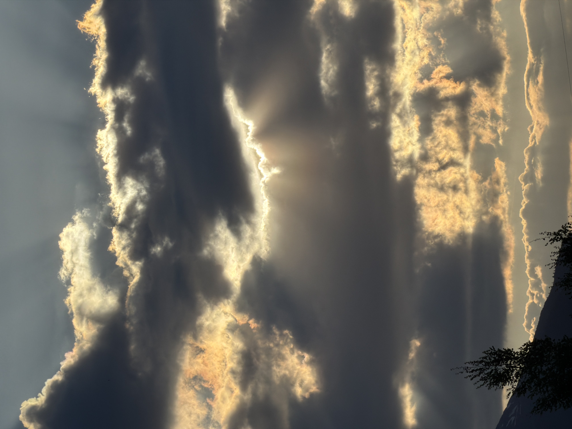 Dramatic sunbeams pierce clouds over Montenegro village