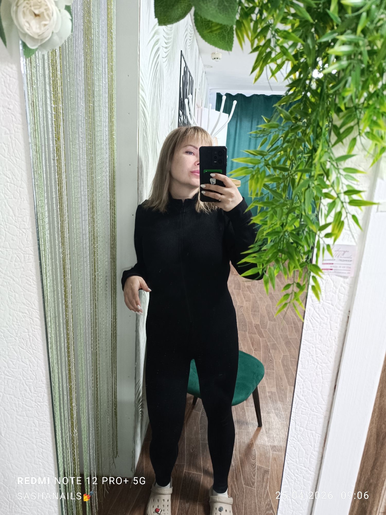 Woman takes mirror selfie in Chaikovsky, Russia