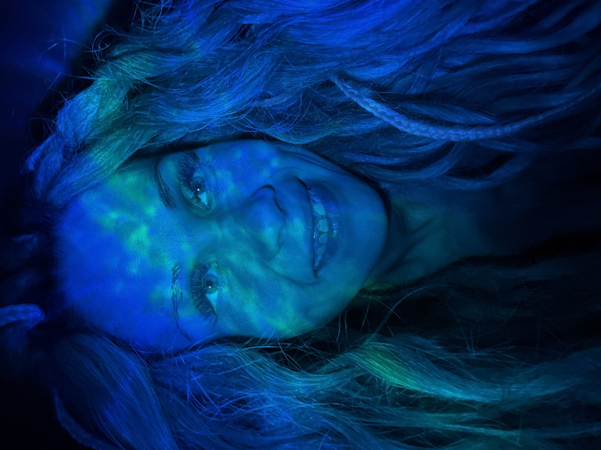 Woman photographed with colored lighting effects in Rusanovo, Russia