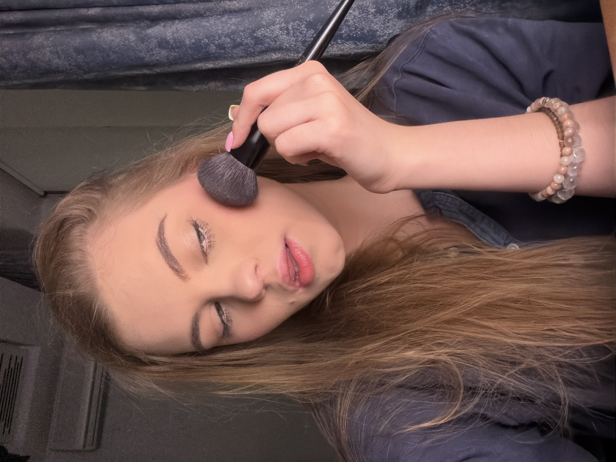 Makeup application caught from two angles, seconds apart.