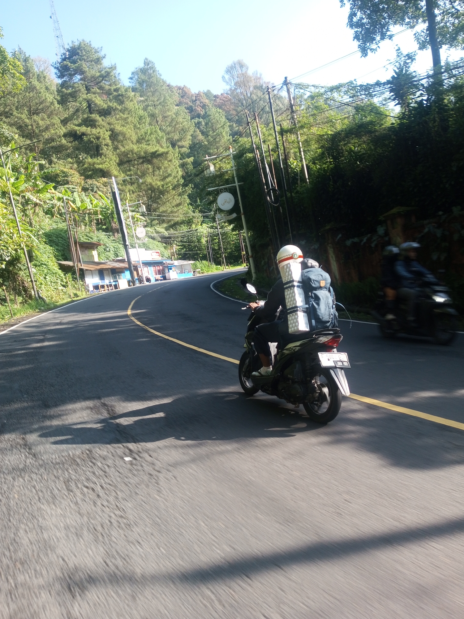 Motorcyclists traverse winding mountain roads in Ti Hay, Myanmar