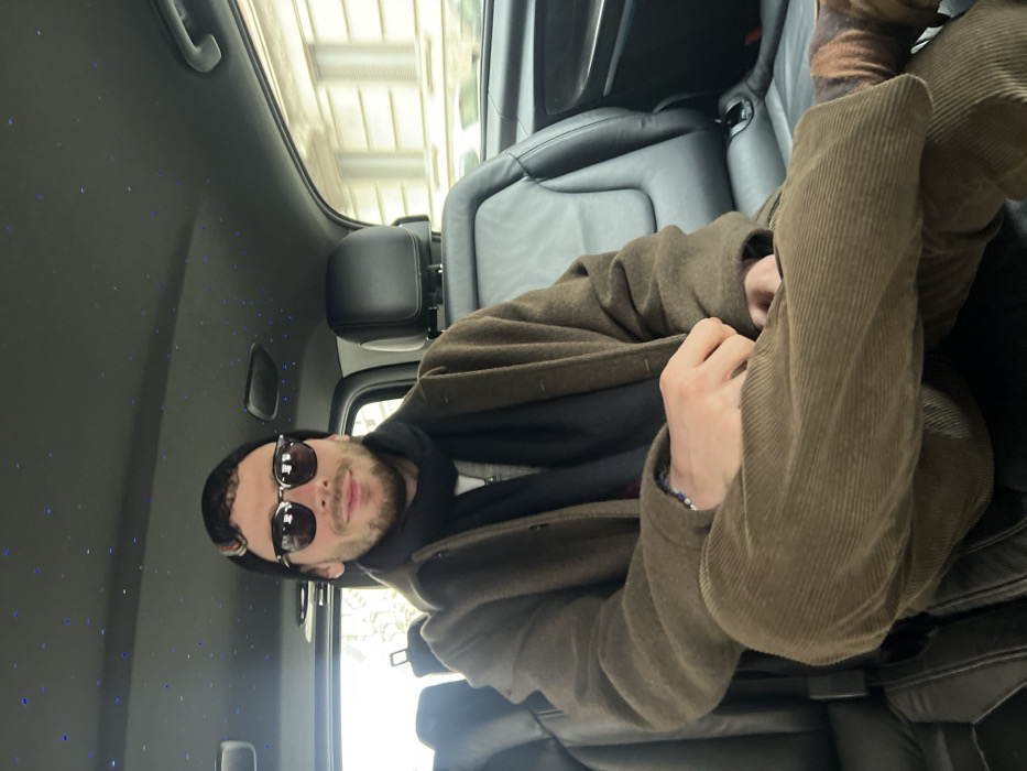Two passengers observed in luxury vehicle in Milan