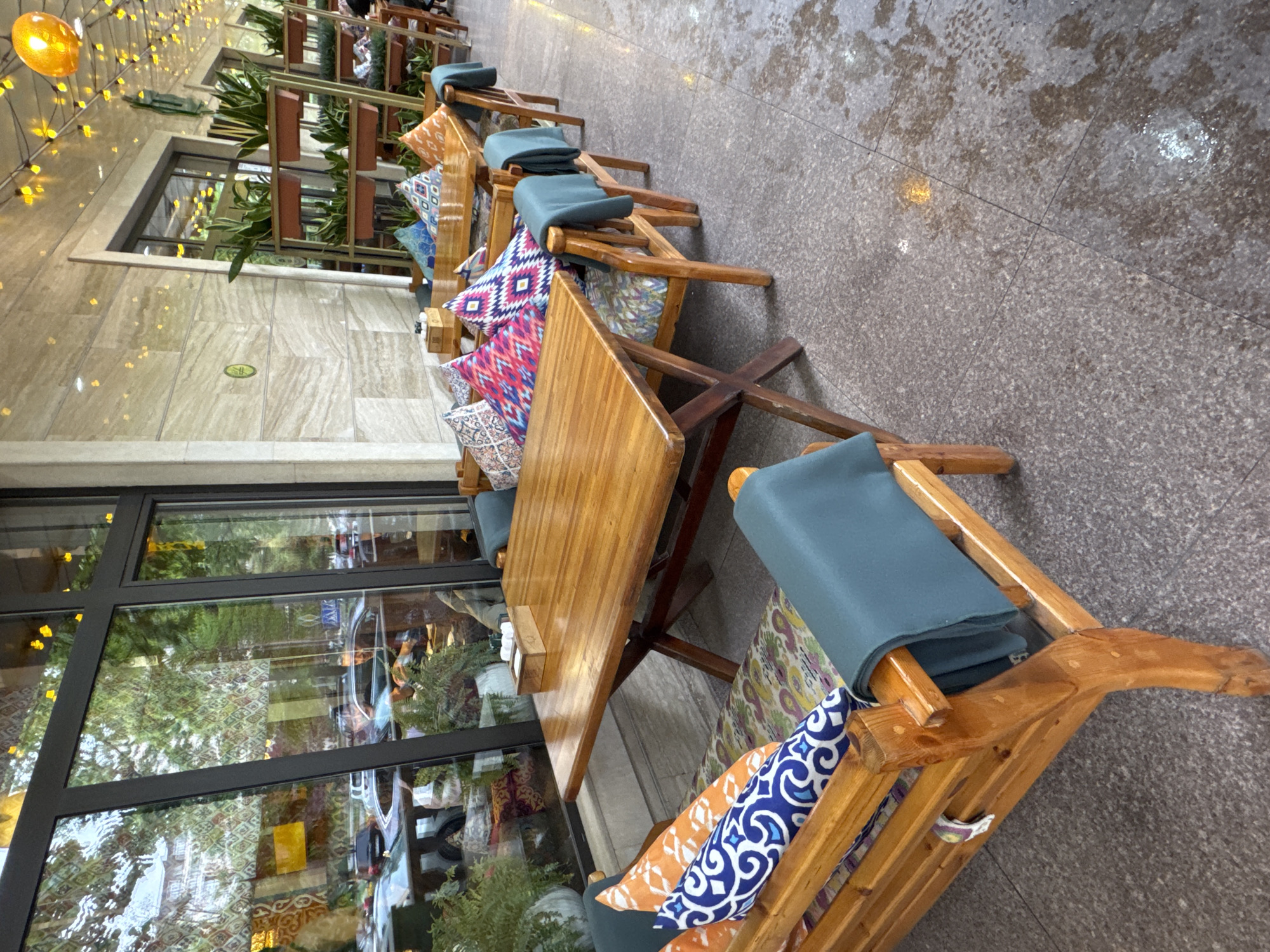 Morning cafe scene captured in post-rain Bishkek streets