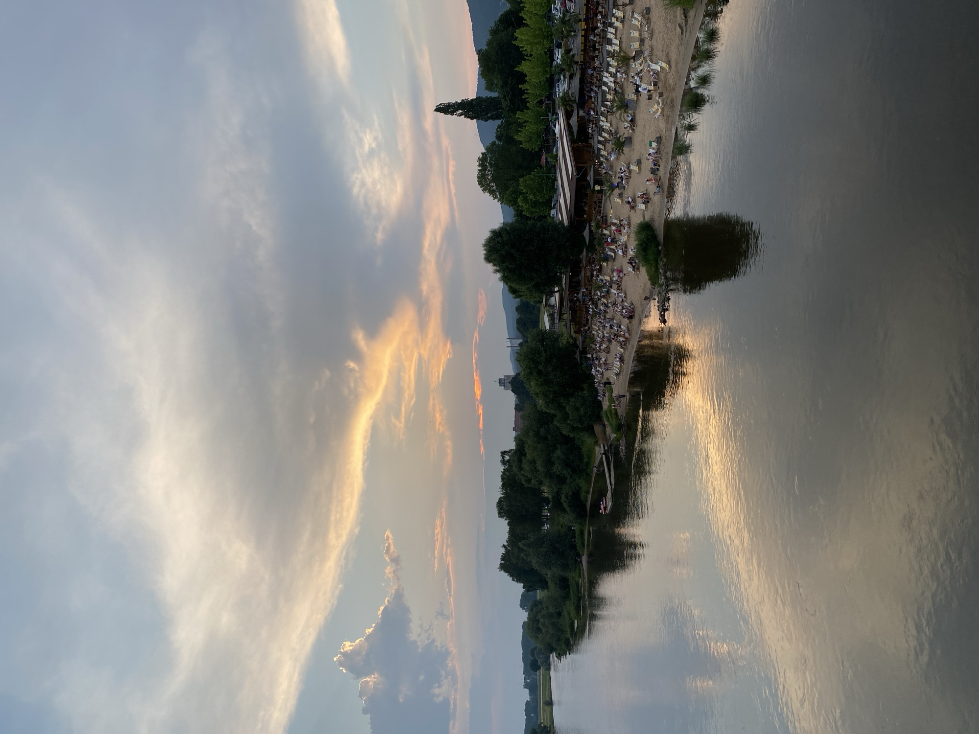 Busy summer evening along the Weser River at sunset