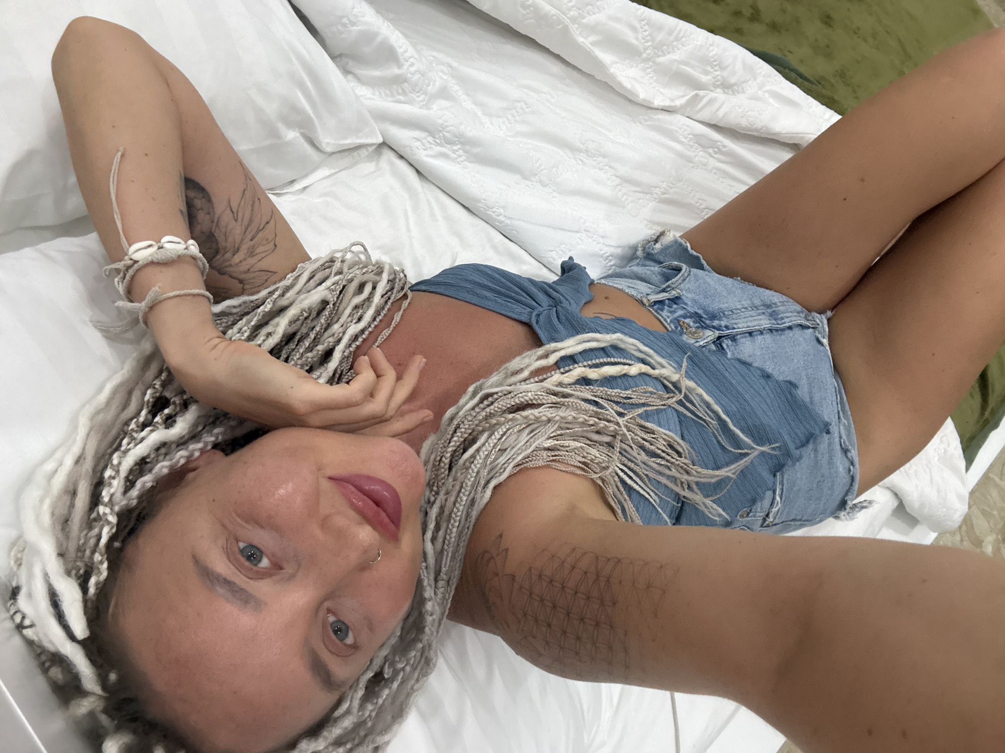Lounging on a hotel bed in Nha Trang, Vietnam