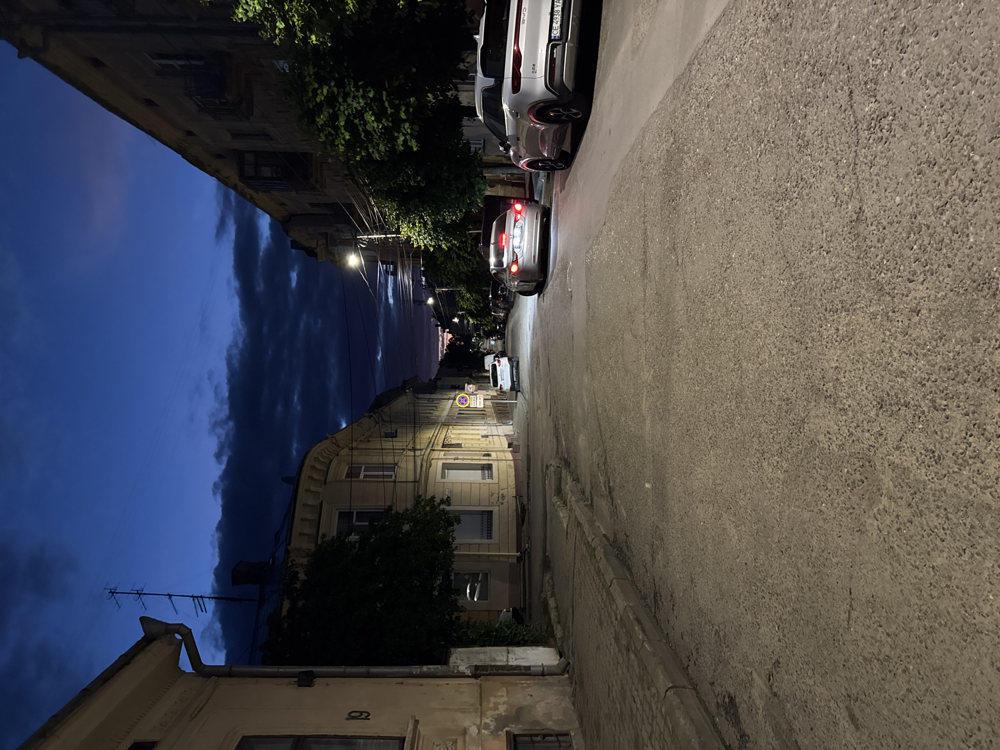 Dusk settles over a quiet Chernivtsi street