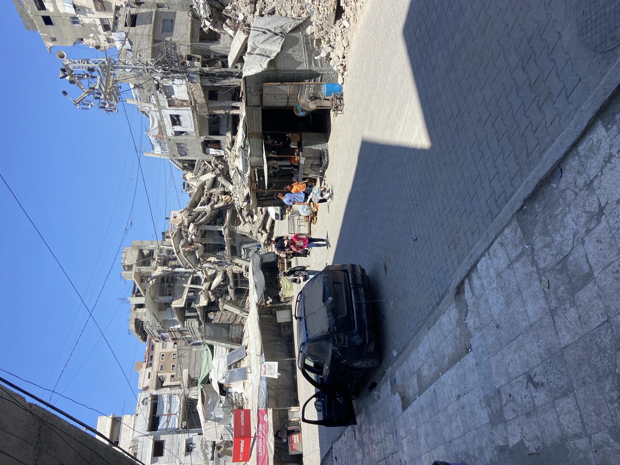 Street-level views of destruction and makeshift shelter in Gaza City