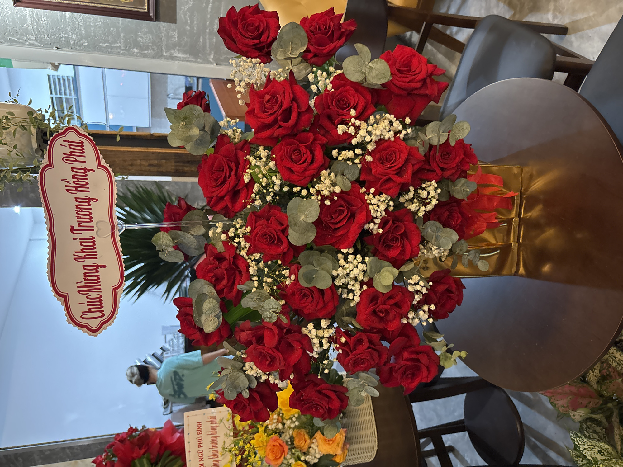 Red roses and a gold-chained dog in Nha Trang