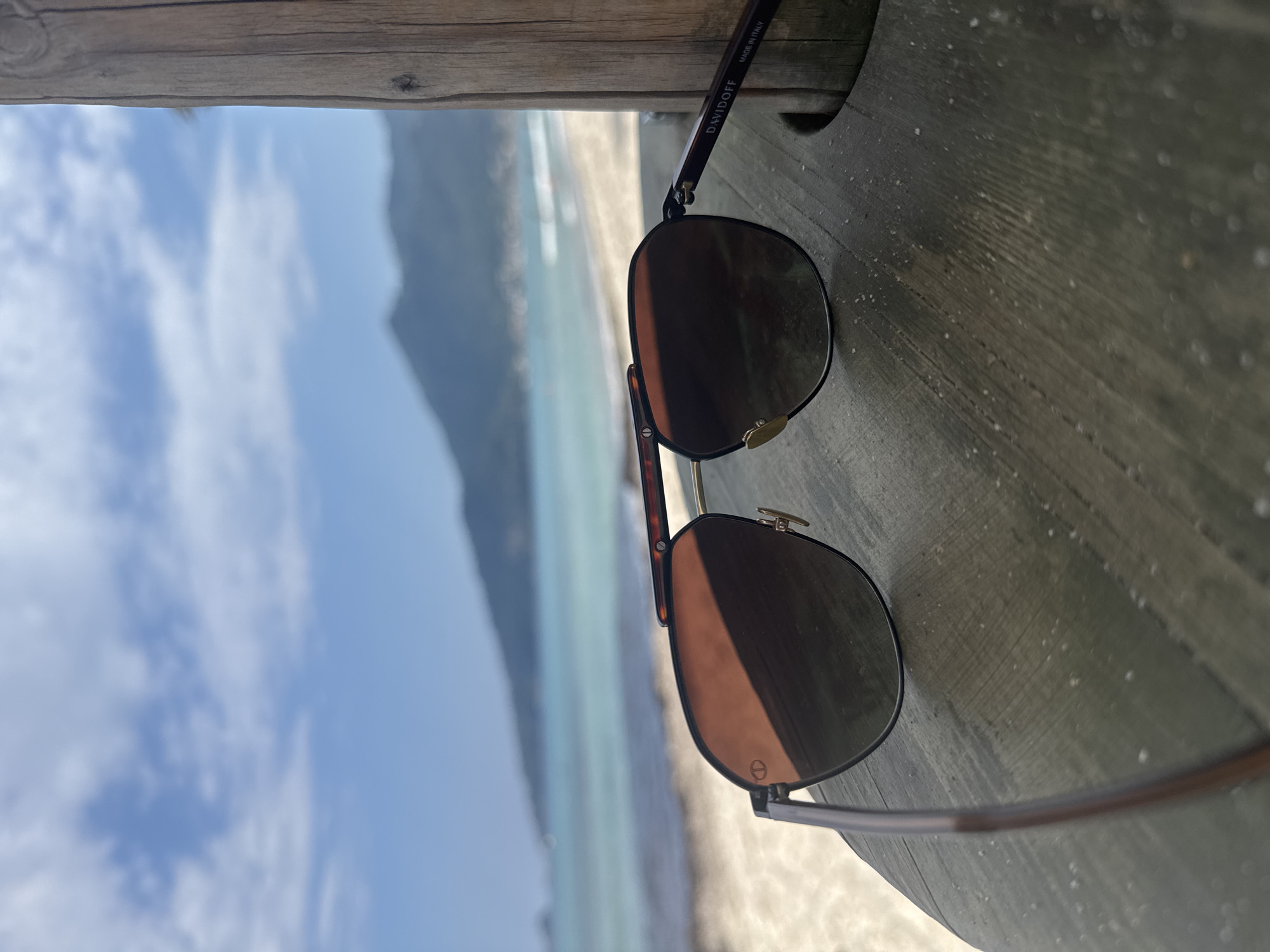 Beach visitor documents sunny afternoon through personal perspective shots