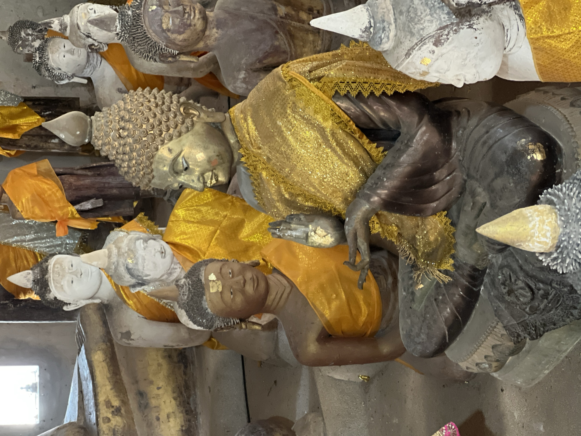 Inside a Ko Samui temple's weathered Buddha statue collection