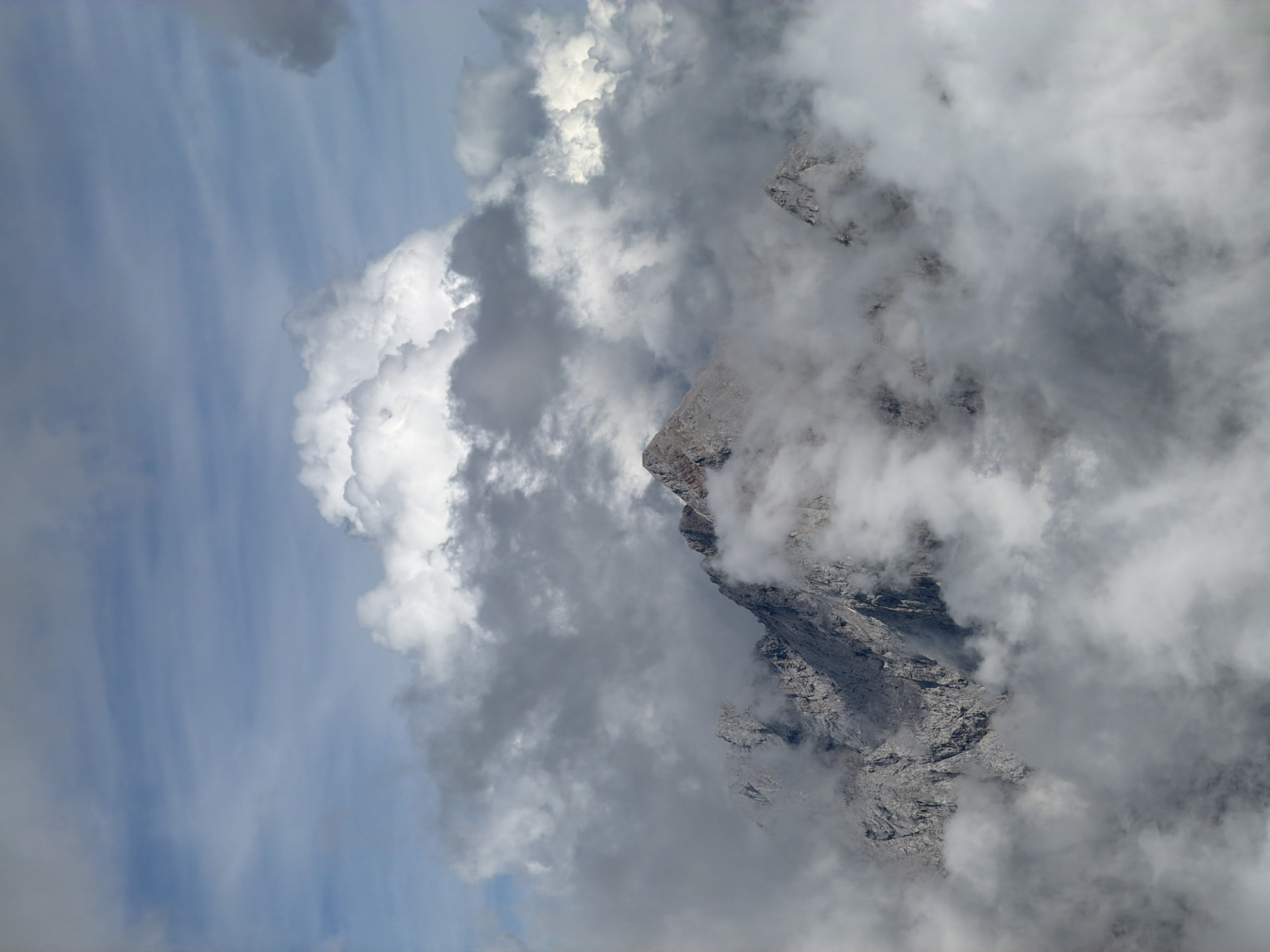 Modern mountain complex emerges from rocky Austrian alpine terrain