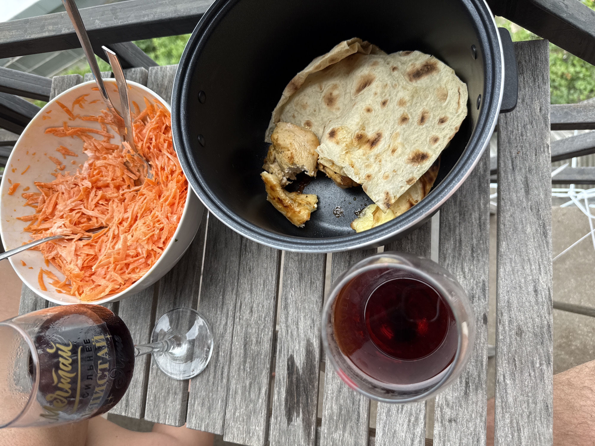 Balcony meal with grilled chicken and wine in Sochi