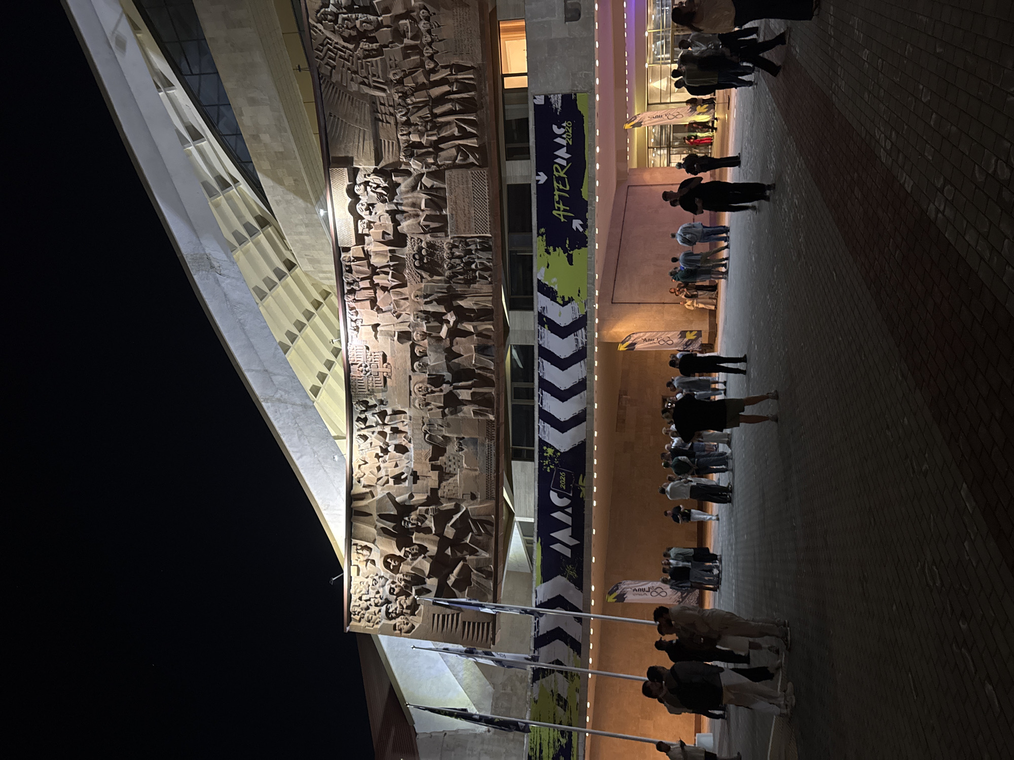 Evening gathering outside decorated building in Yerevan, Armenia