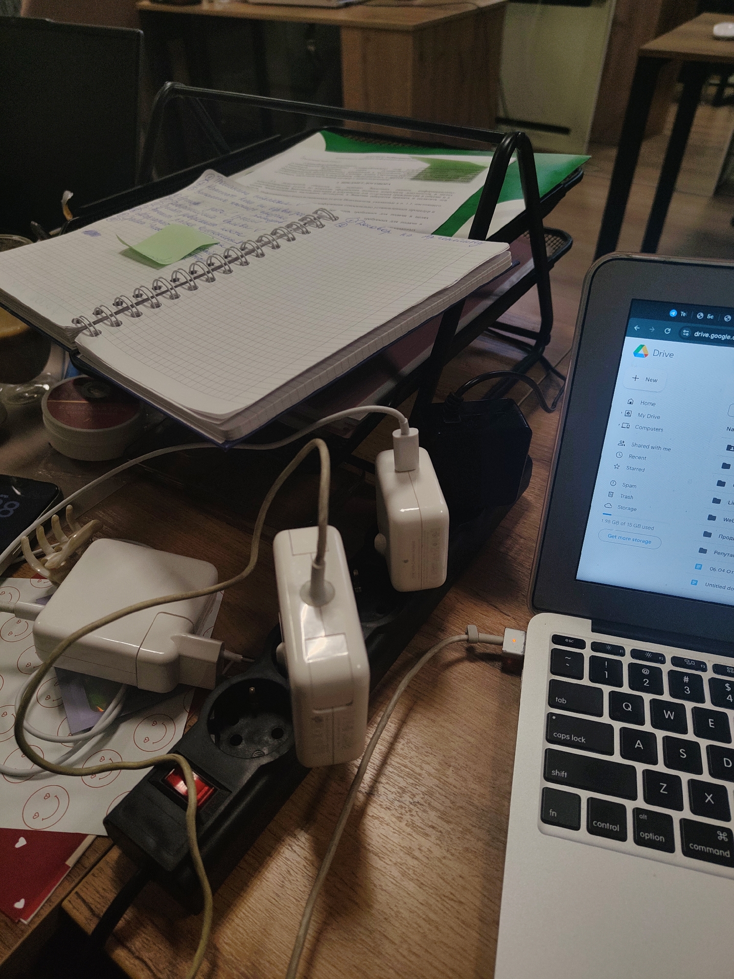 Moscow workspace captured with notebook, laptop, documents