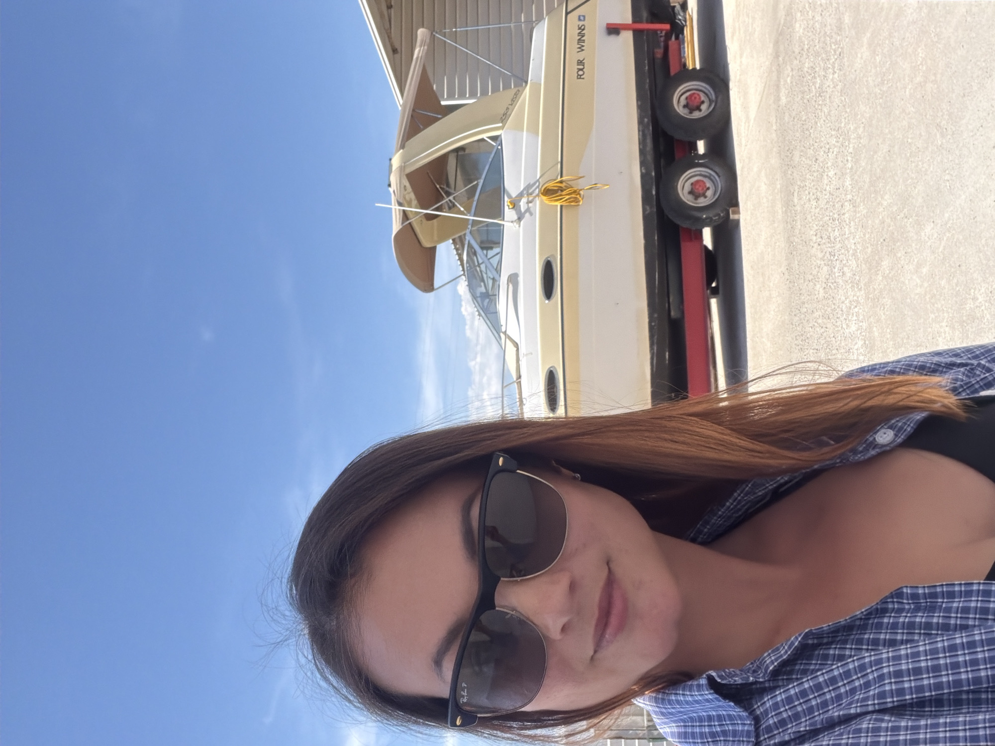 Woman takes selfies in Radanovići, Montenegro on sunny day