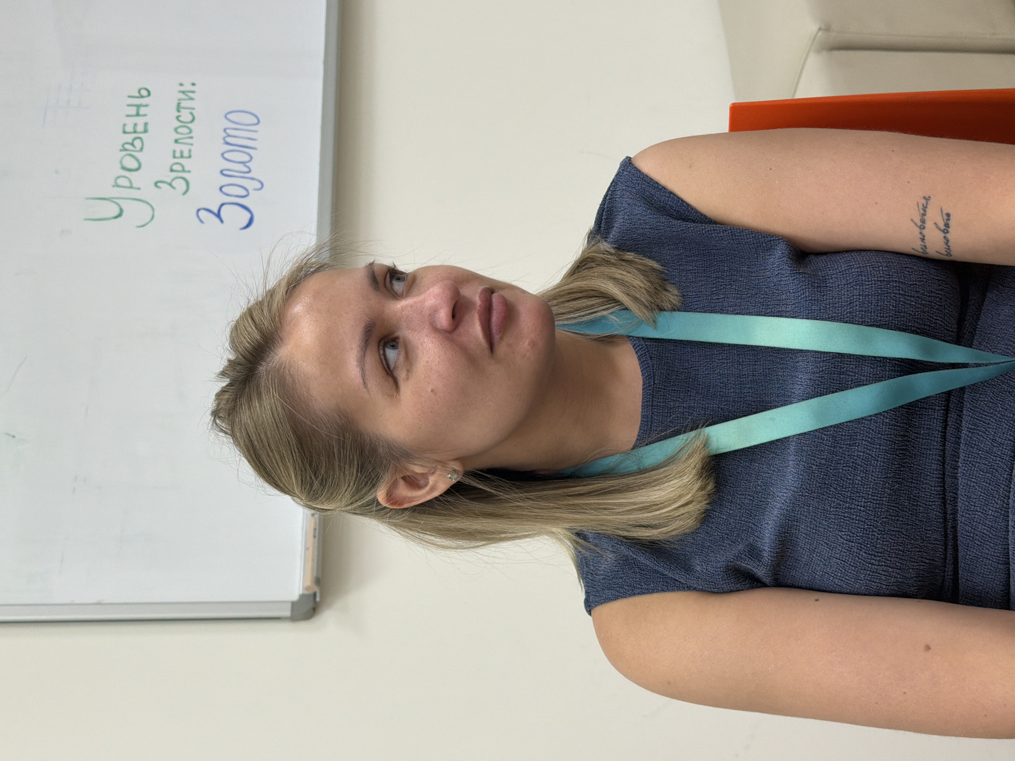 Woman observed studying whiteboard in Krasnoyarsk classroom setting