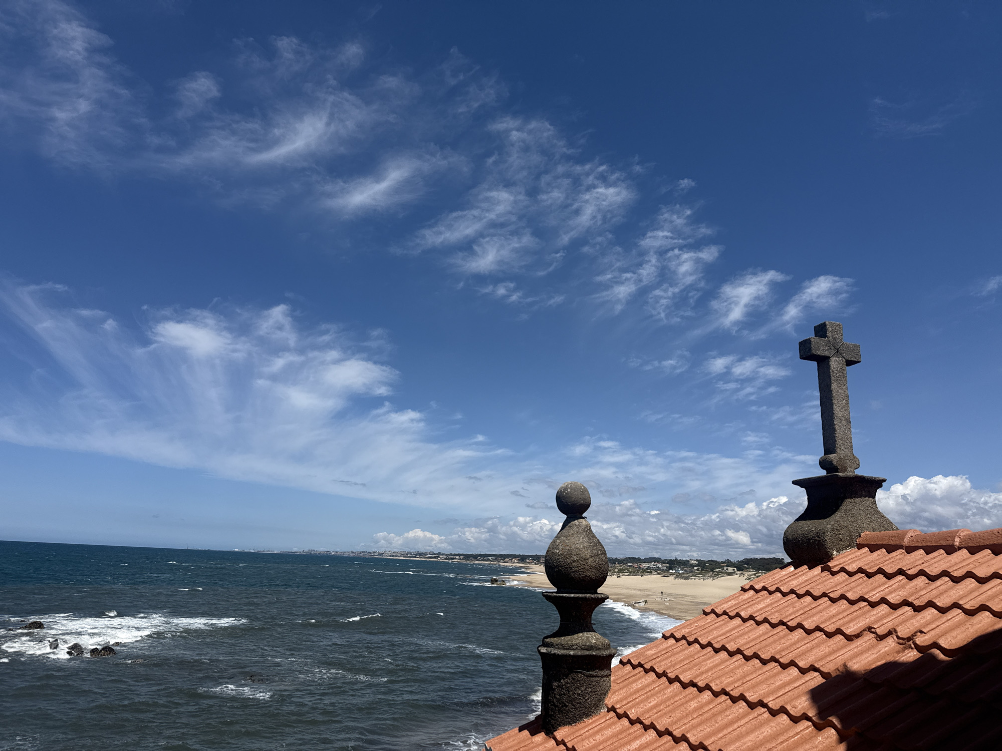 Tourist documents church and coastal scenery in Vila Nova de Gaia