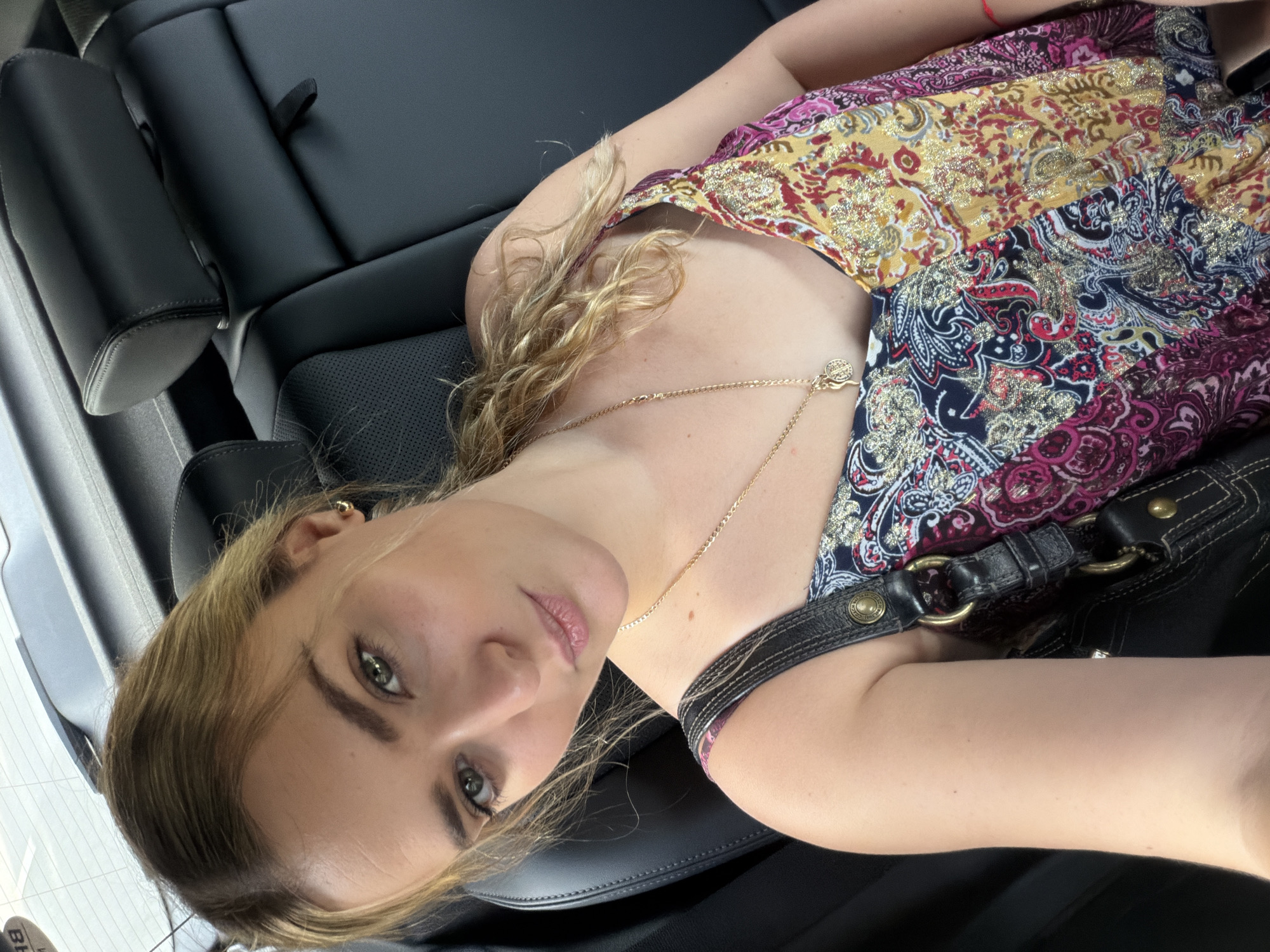 Woman rests in vehicle back seat in Miami