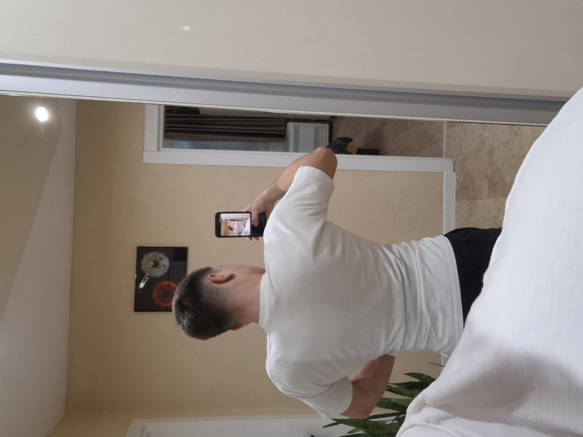 Resident takes mirror selfies while moving through Veliki Preslav home