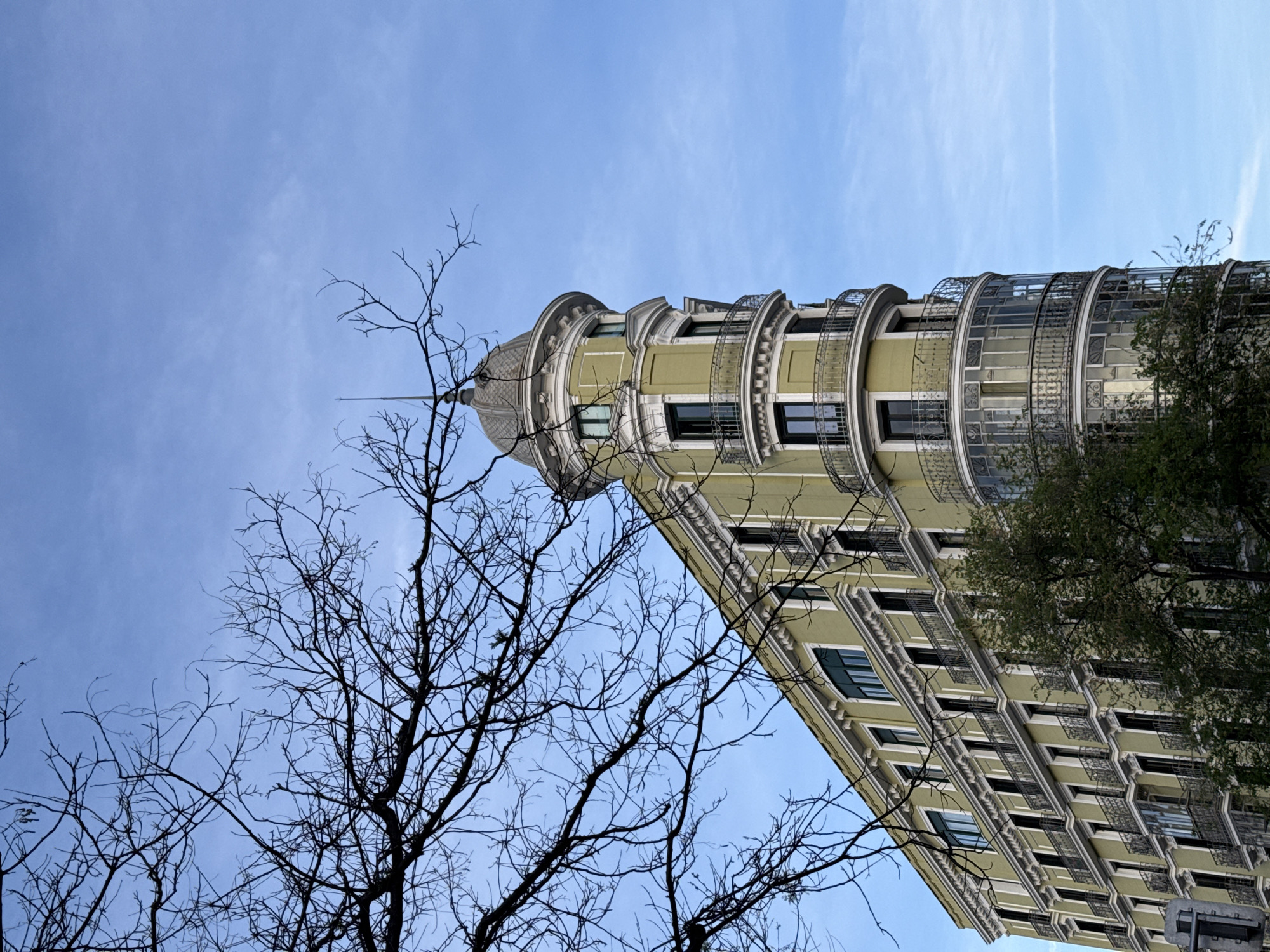 Madrid building with dome turret observed against spring sky