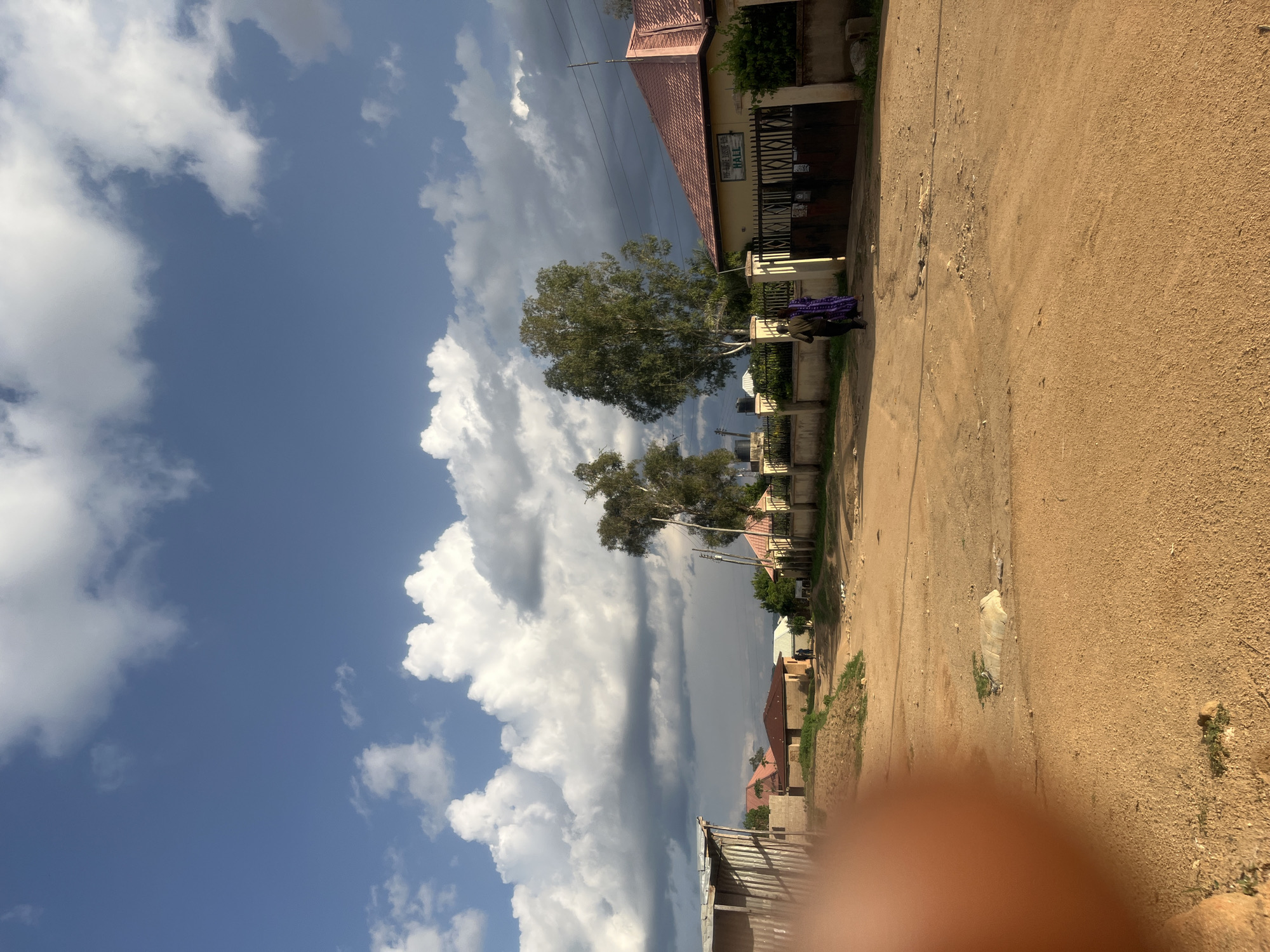 Daily life captured on dirt roads in Nigerian community