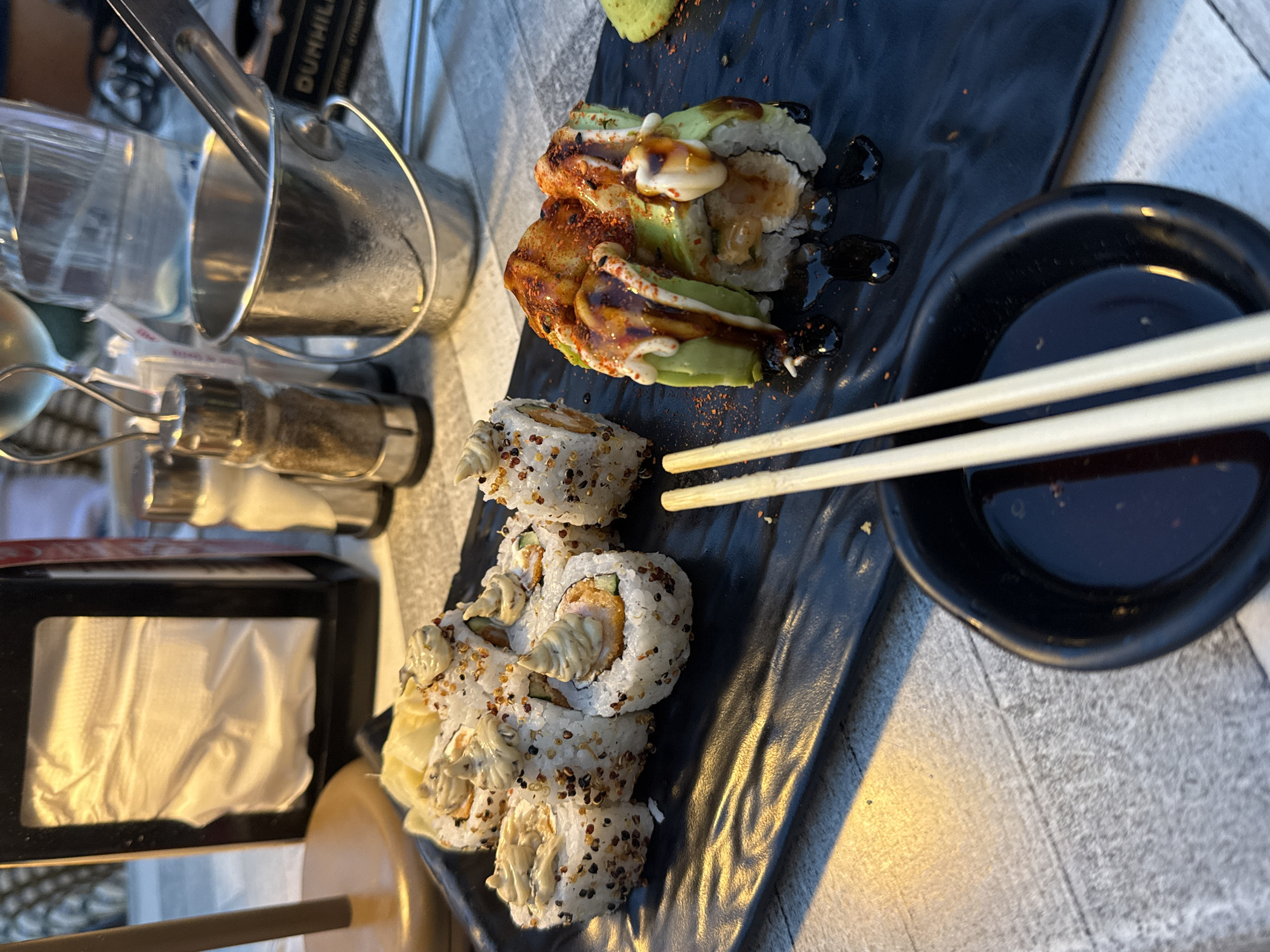 Sushi, salad, and marigolds at a Varna dining spot