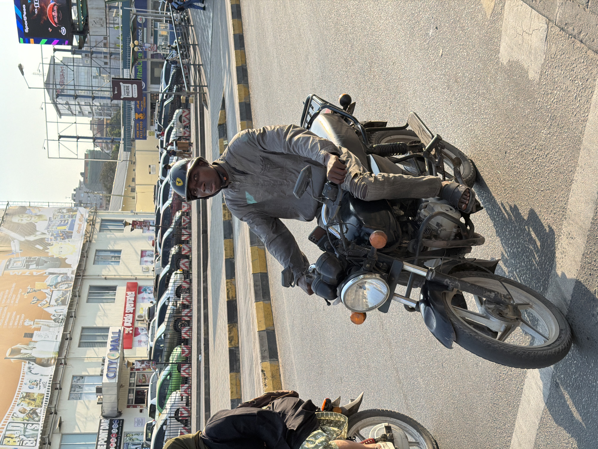 Midday street traffic and pedestrians moving through Dar es Salaam