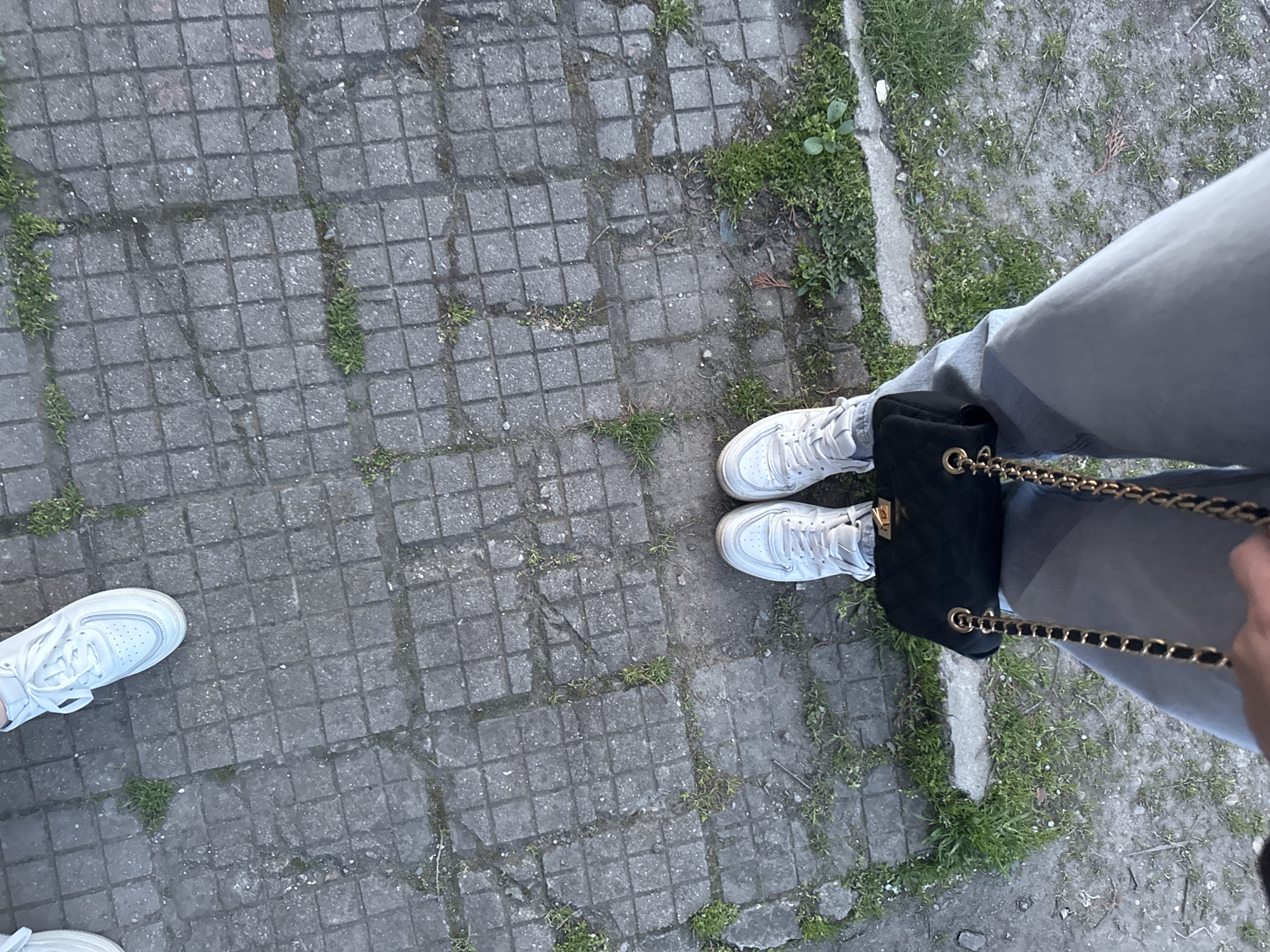 Person stands on weathered concrete tiles in Lehchevo, Bulgaria