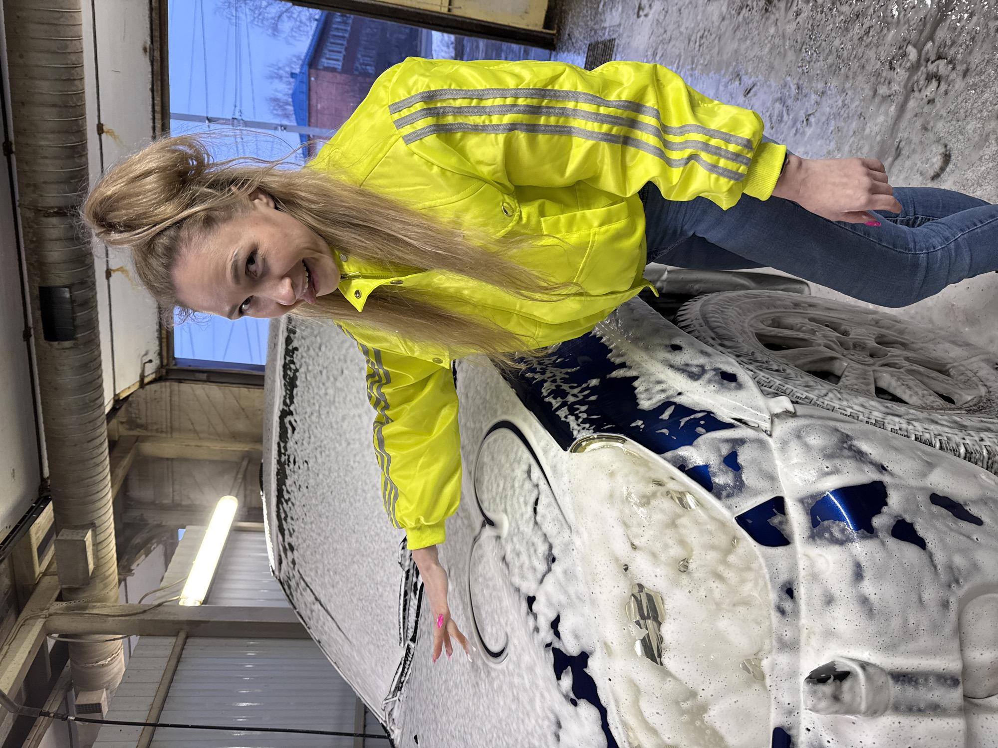 Woman washes car at Chaikovsky facility, draws heart in foam