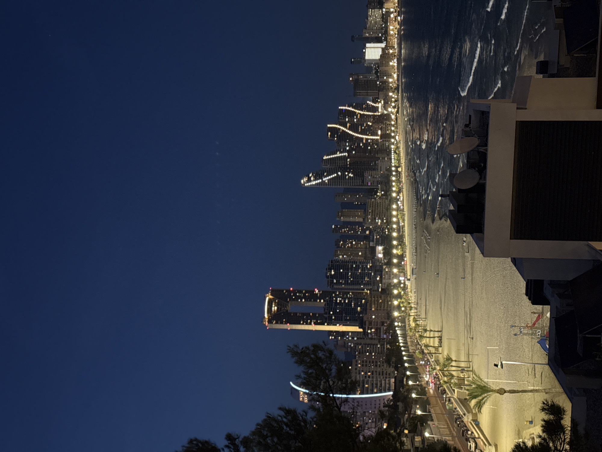 Benidorm's beachfront skyline at night, from multiple vantage points