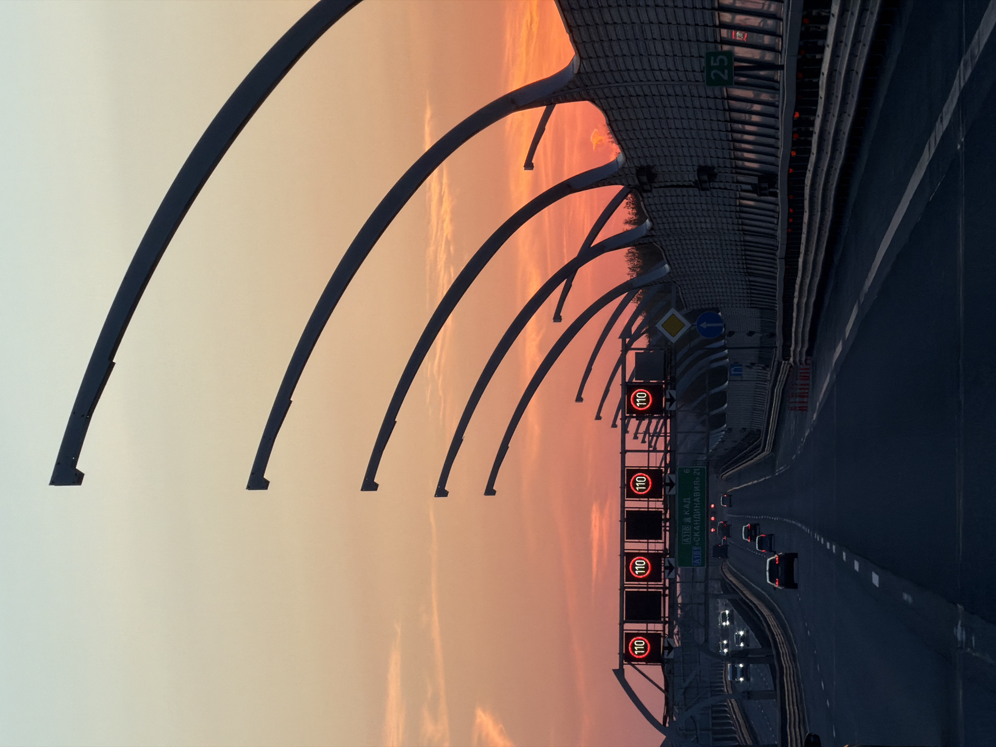 Evening traffic flows on Saint Petersburg highway at sunset