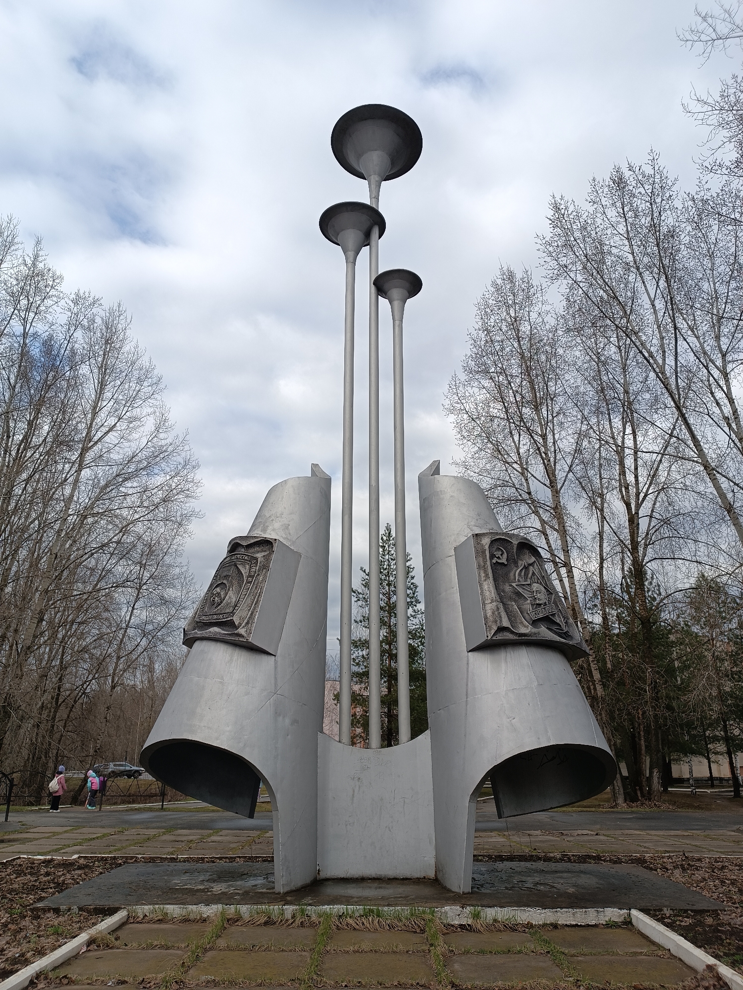 Three-pole metallic monument observed in Chaikovsky park