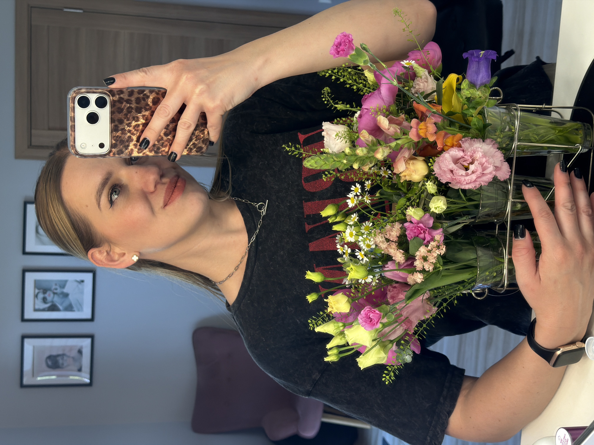 Woman documents afternoon with pet dog and flowers in Riga