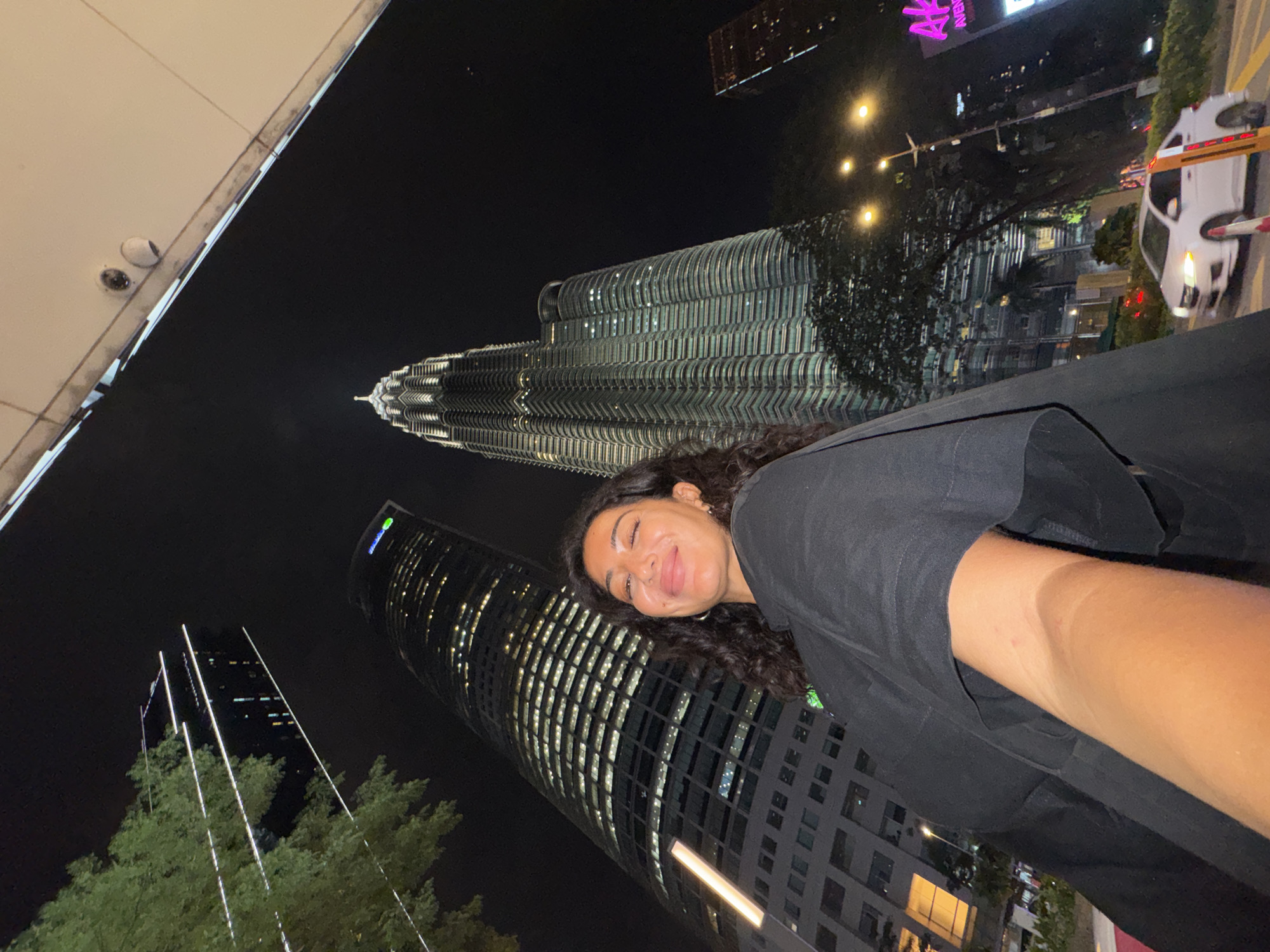Woman documents nighttime visit to Petronas Towers in Kuala Lumpur