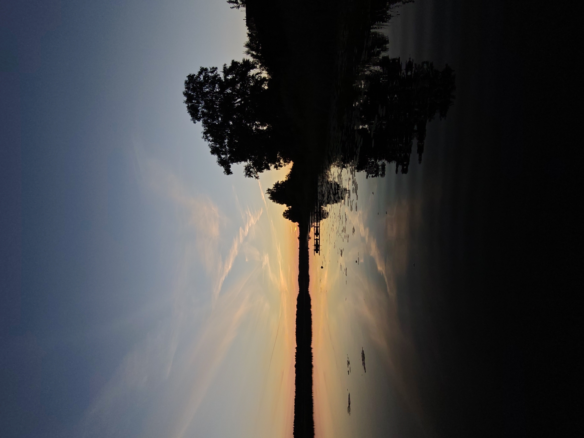 Sunset over a calm lake near Inogoshcha, Russia