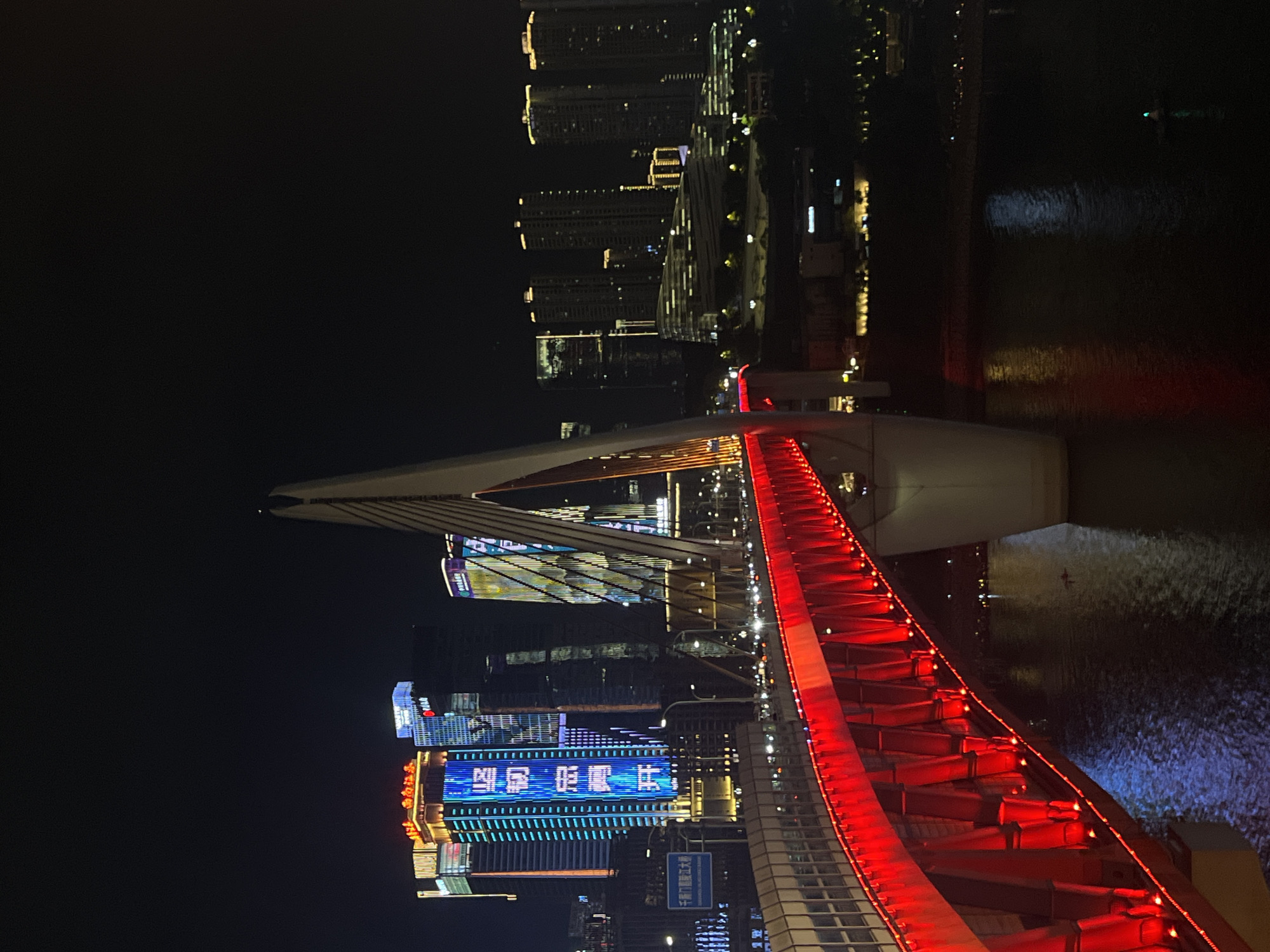 Hongyadong Bridge lit up red along Chongqing's Yangtze waterfront