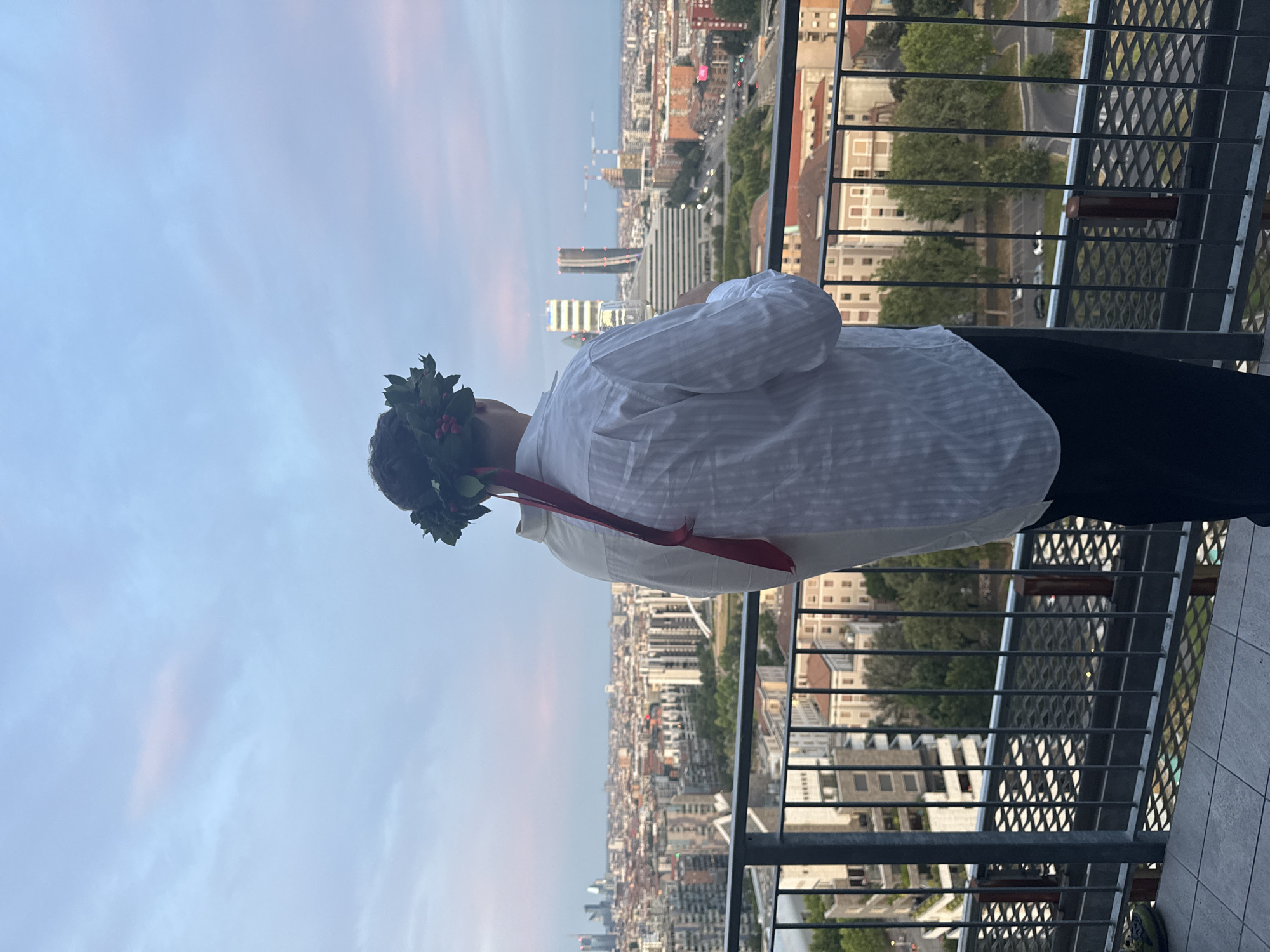 Rooftop graduation party with DJ and Milan skyline views