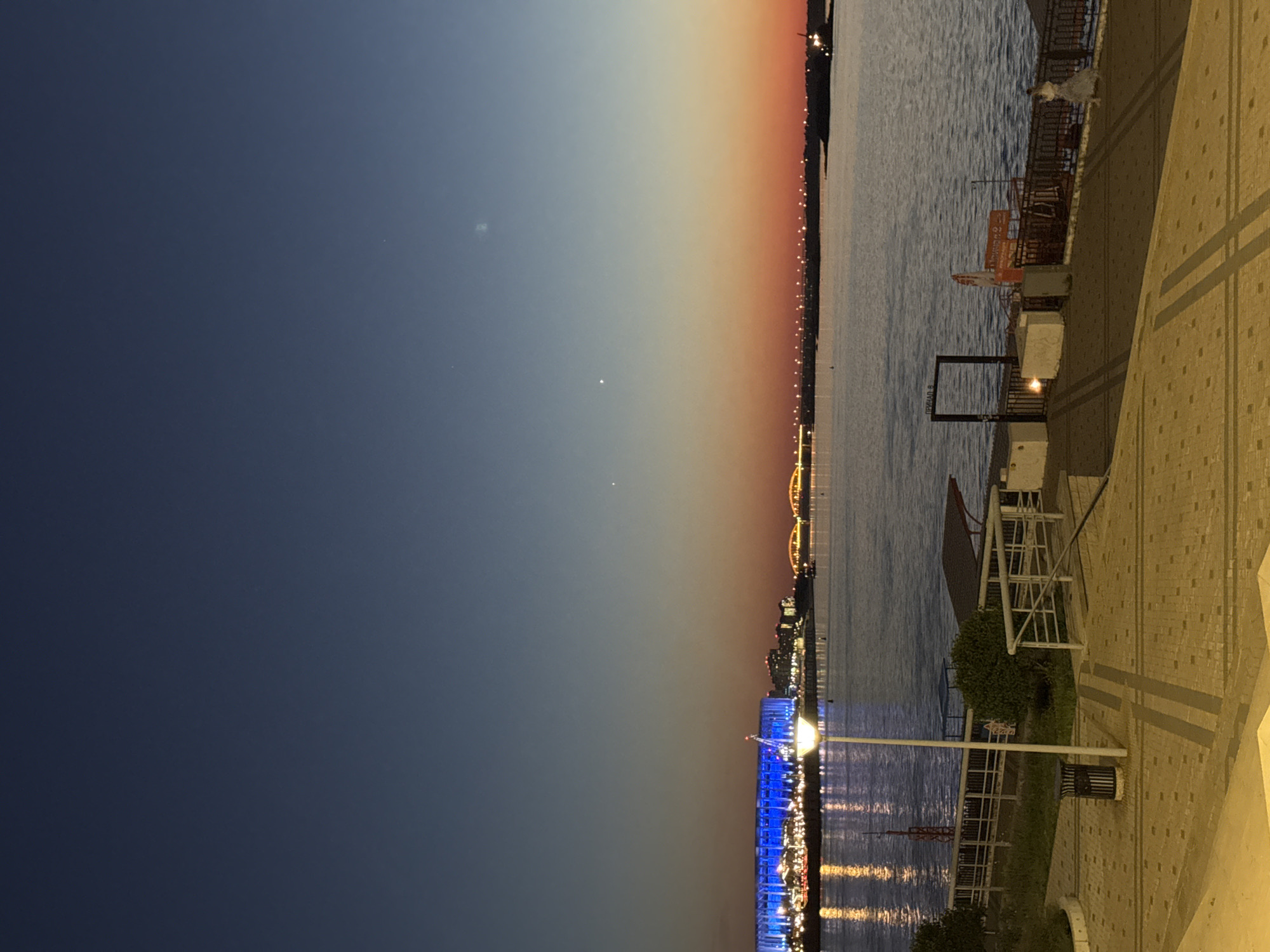 Evening stroll documented through illuminated Nizhny Novgorod landmarks and riverfront
