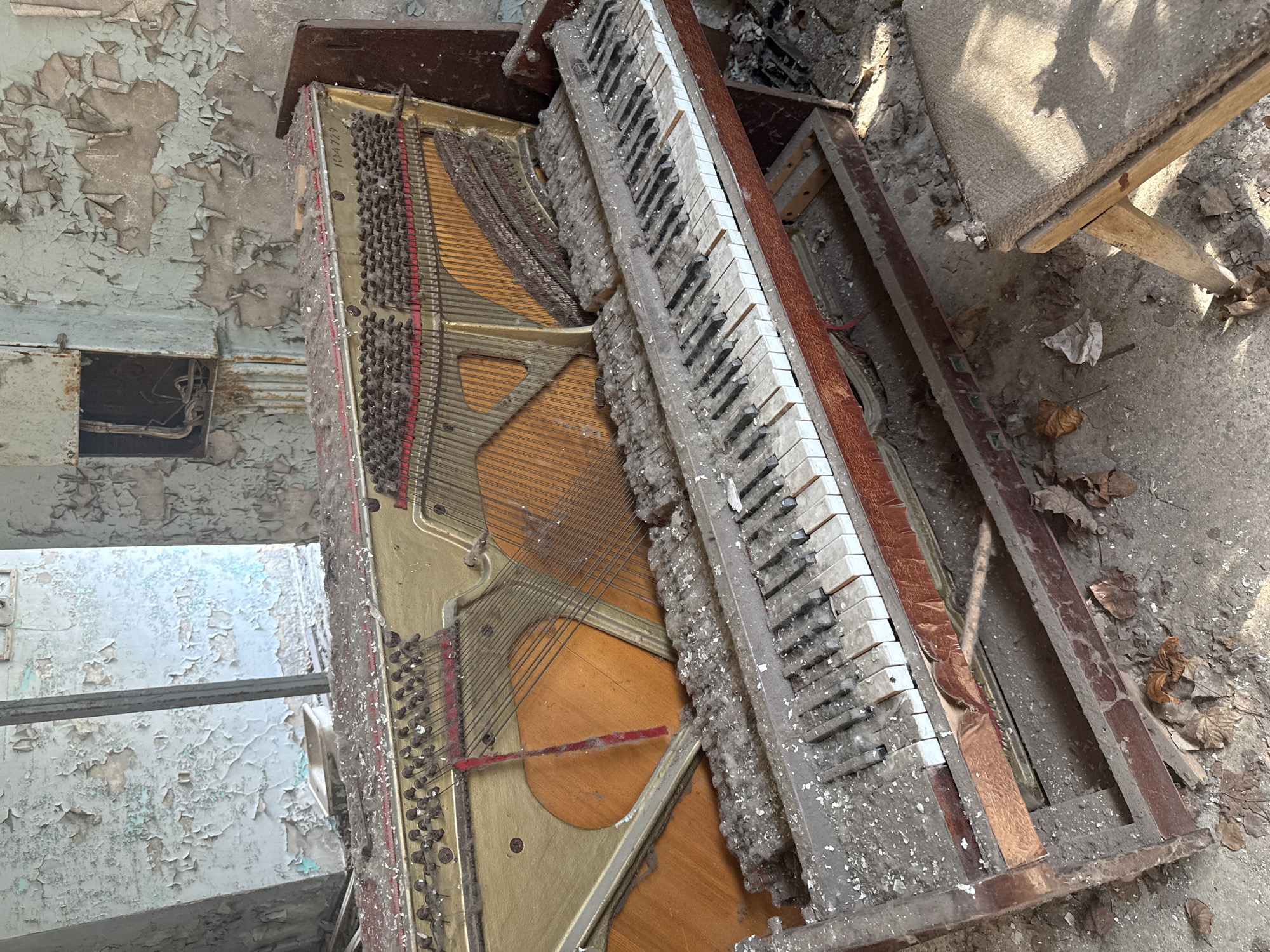 Decaying piano documented in abandoned Prypiat building