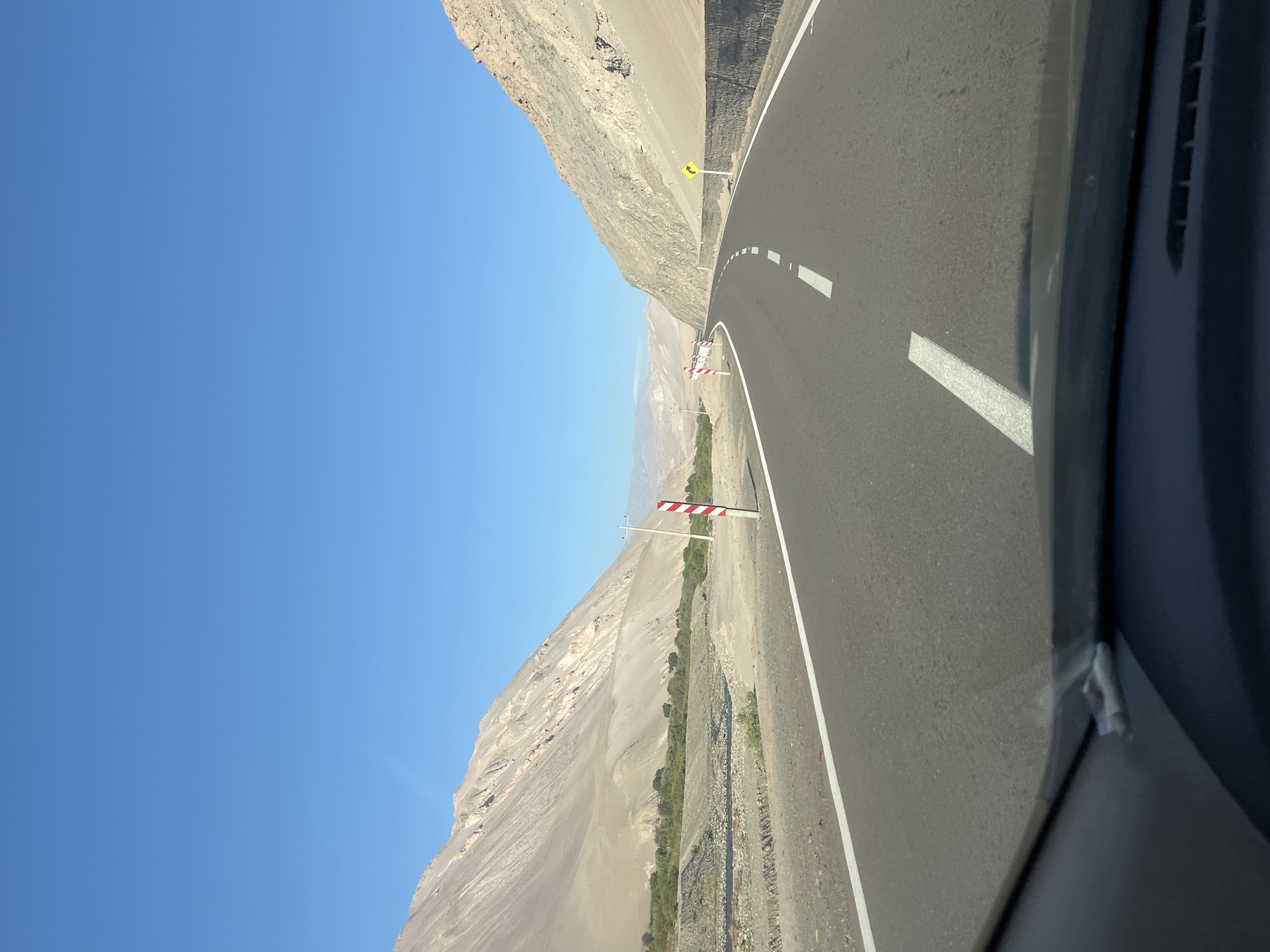 Driver navigates curved road in Arica, Chile