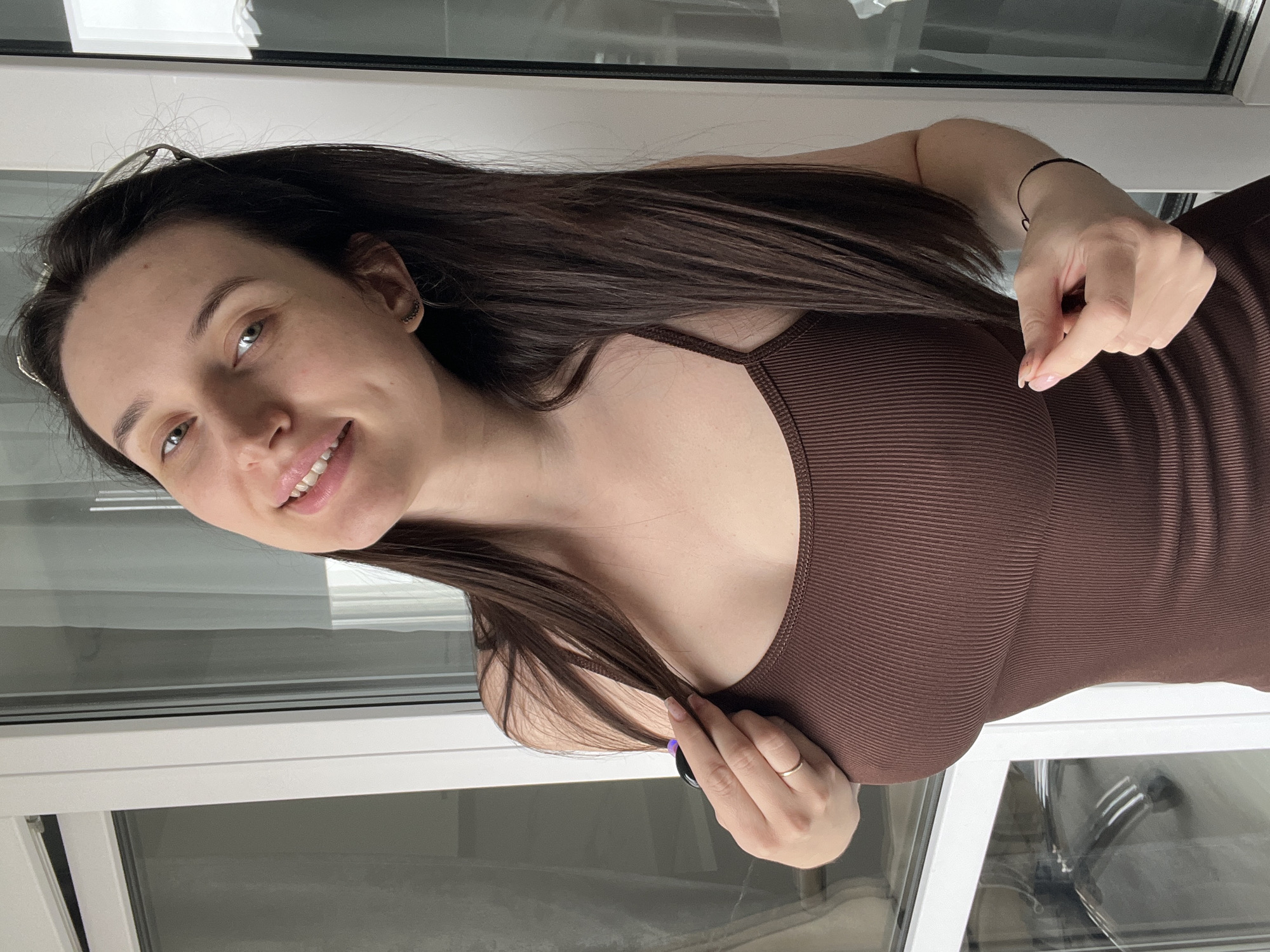 Woman documents morning workout routine and cat interactions in Tyumen