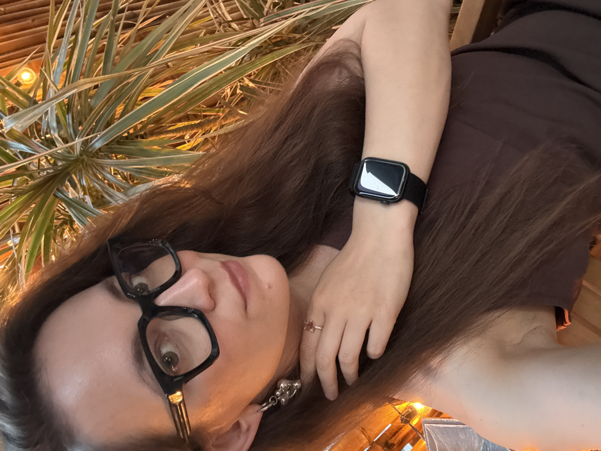 Woman takes selfies on Moscow street during afternoon