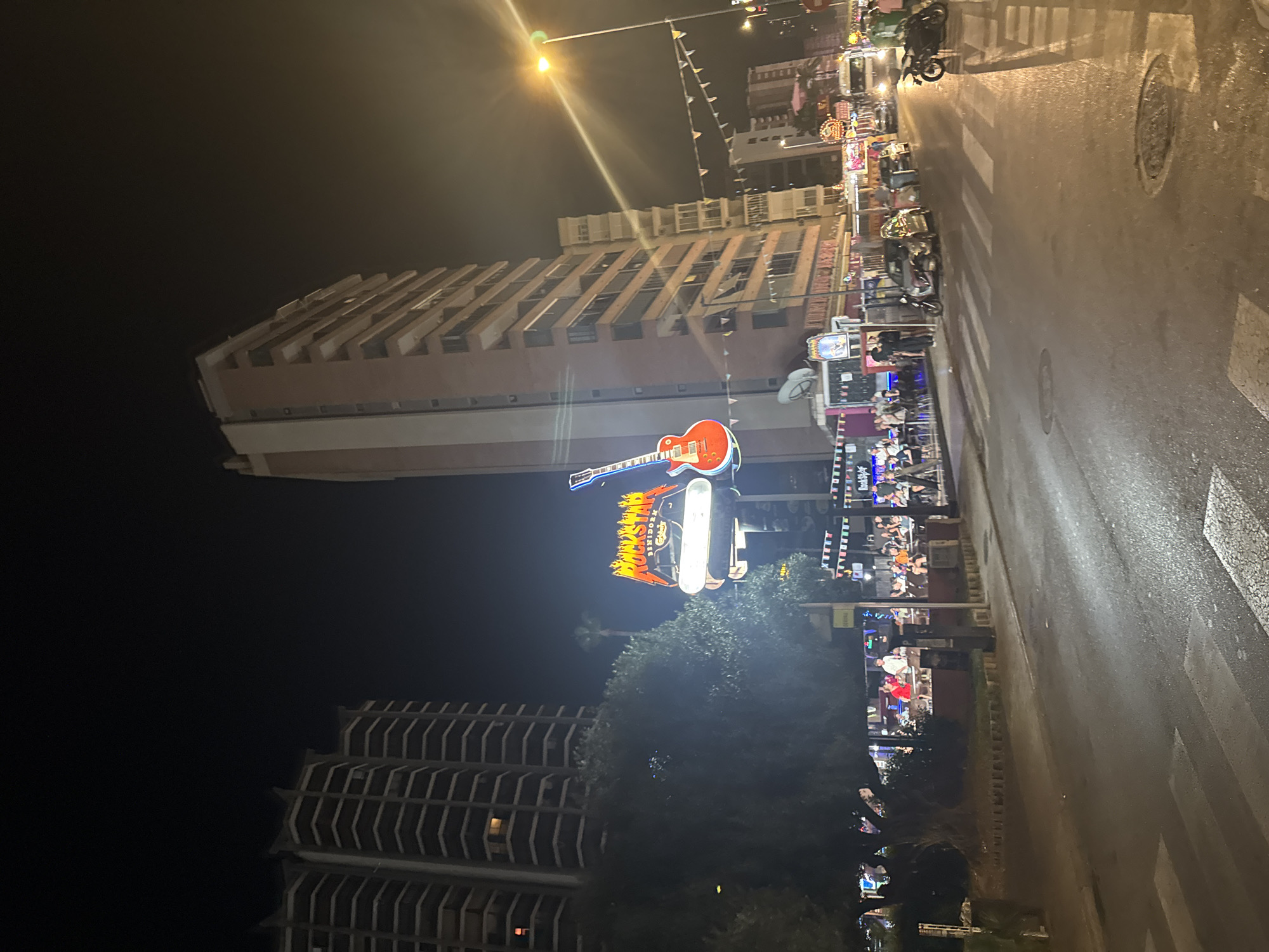 Benidorm's neon-lit nightlife strip after midnight