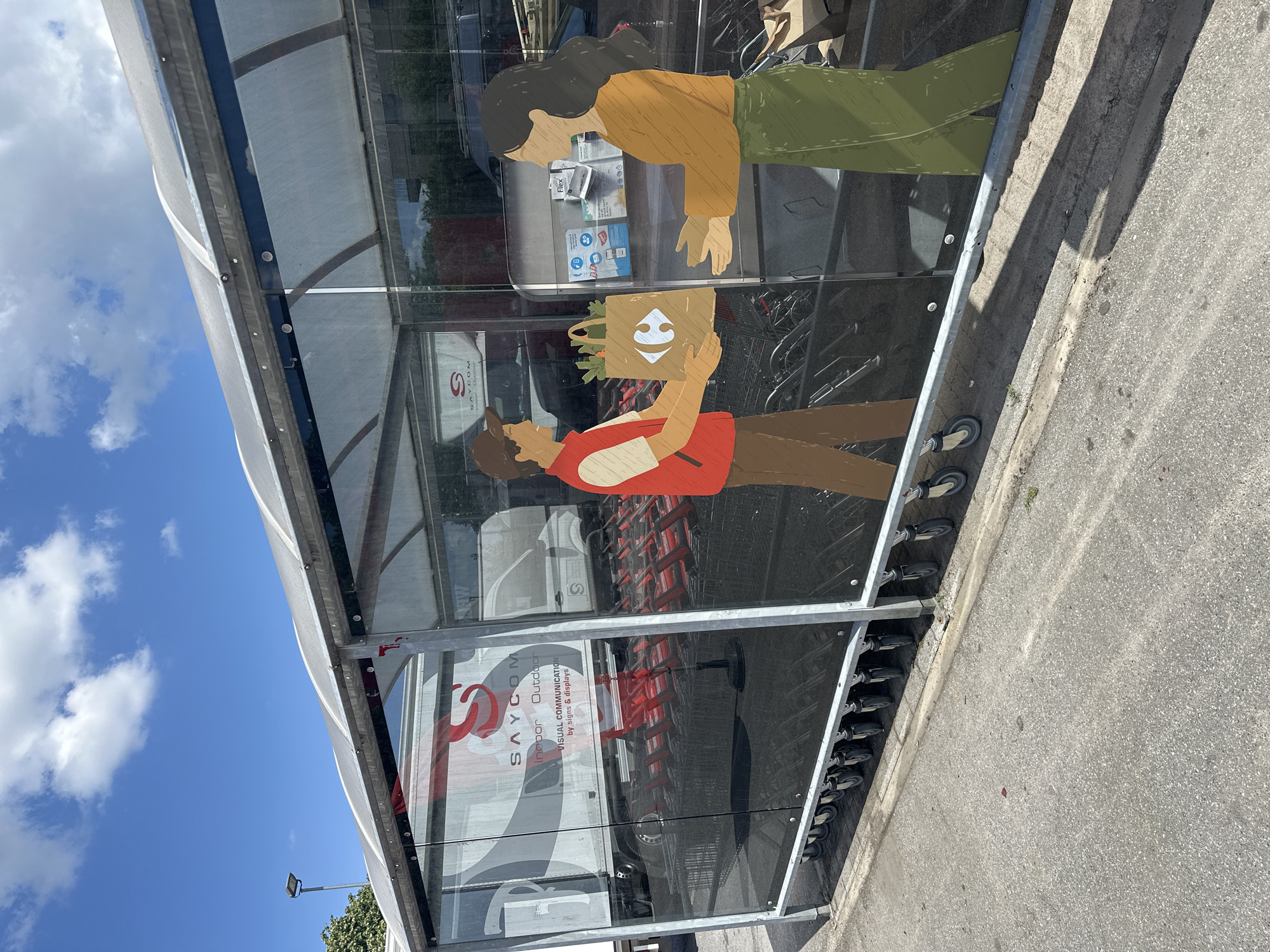 Carrefour Market exterior on a sunny day in Bornem