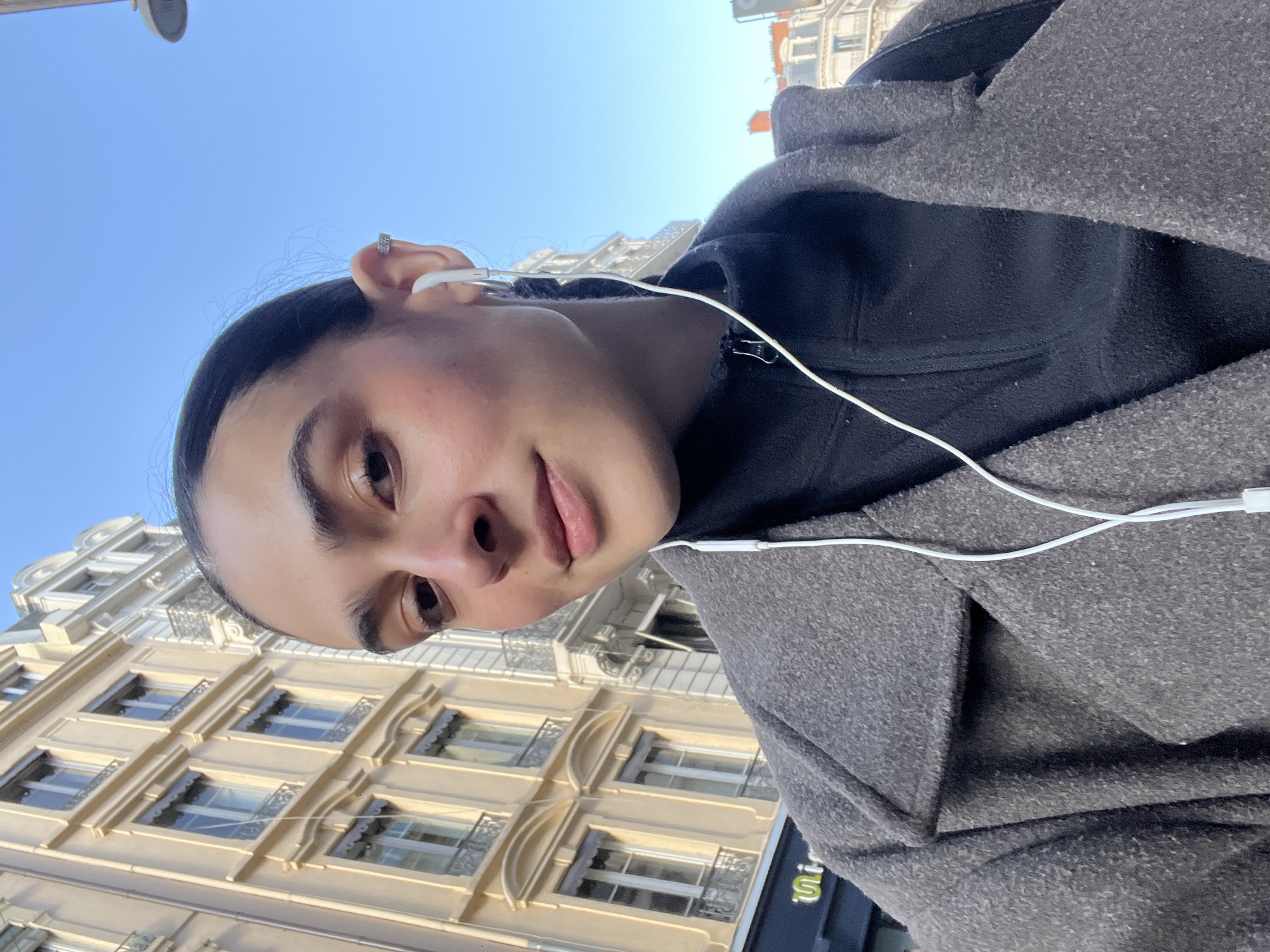 Person takes sunny day selfie in Lyon, France